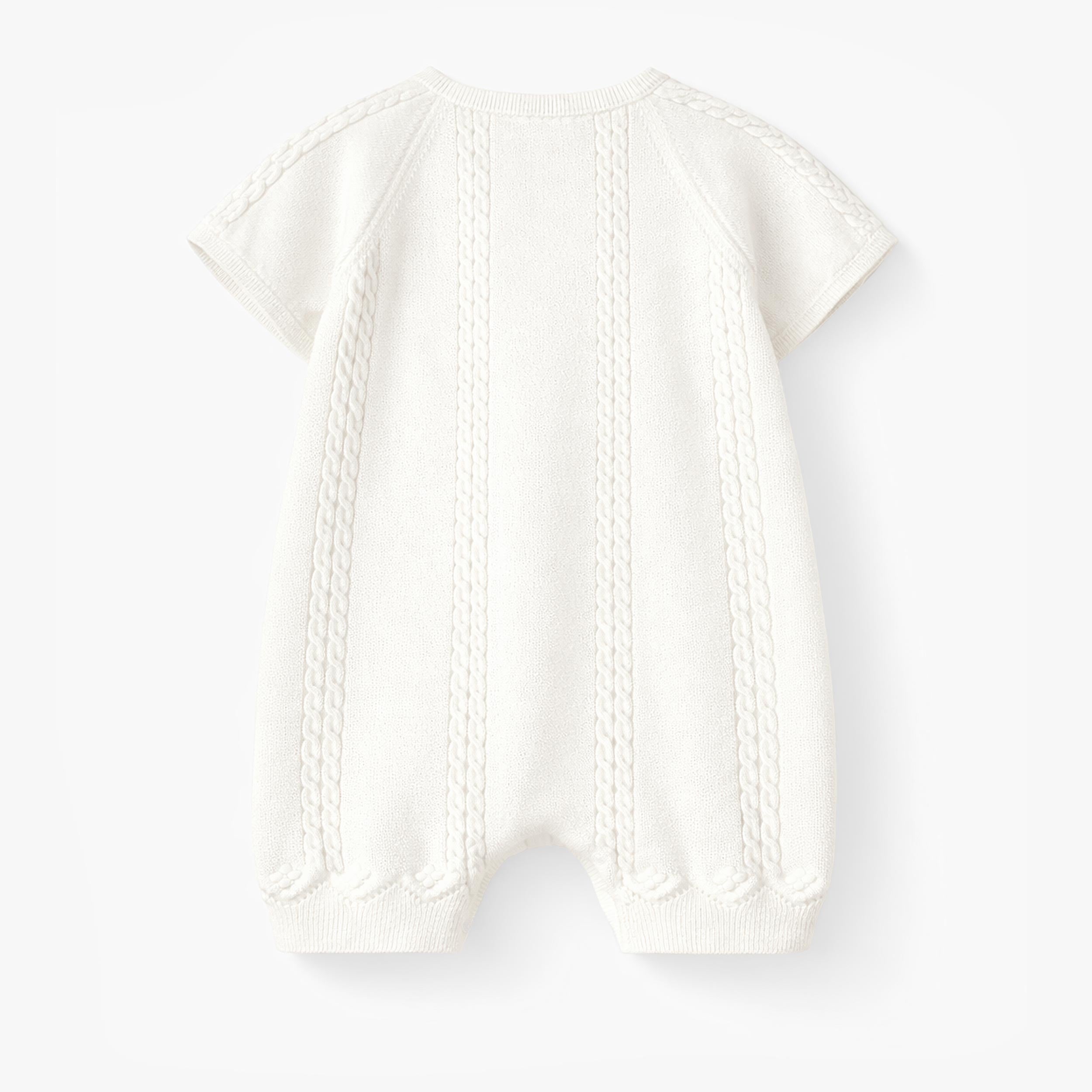 Dos de la barboteuse crème en tricot à motif pointelle, naissance