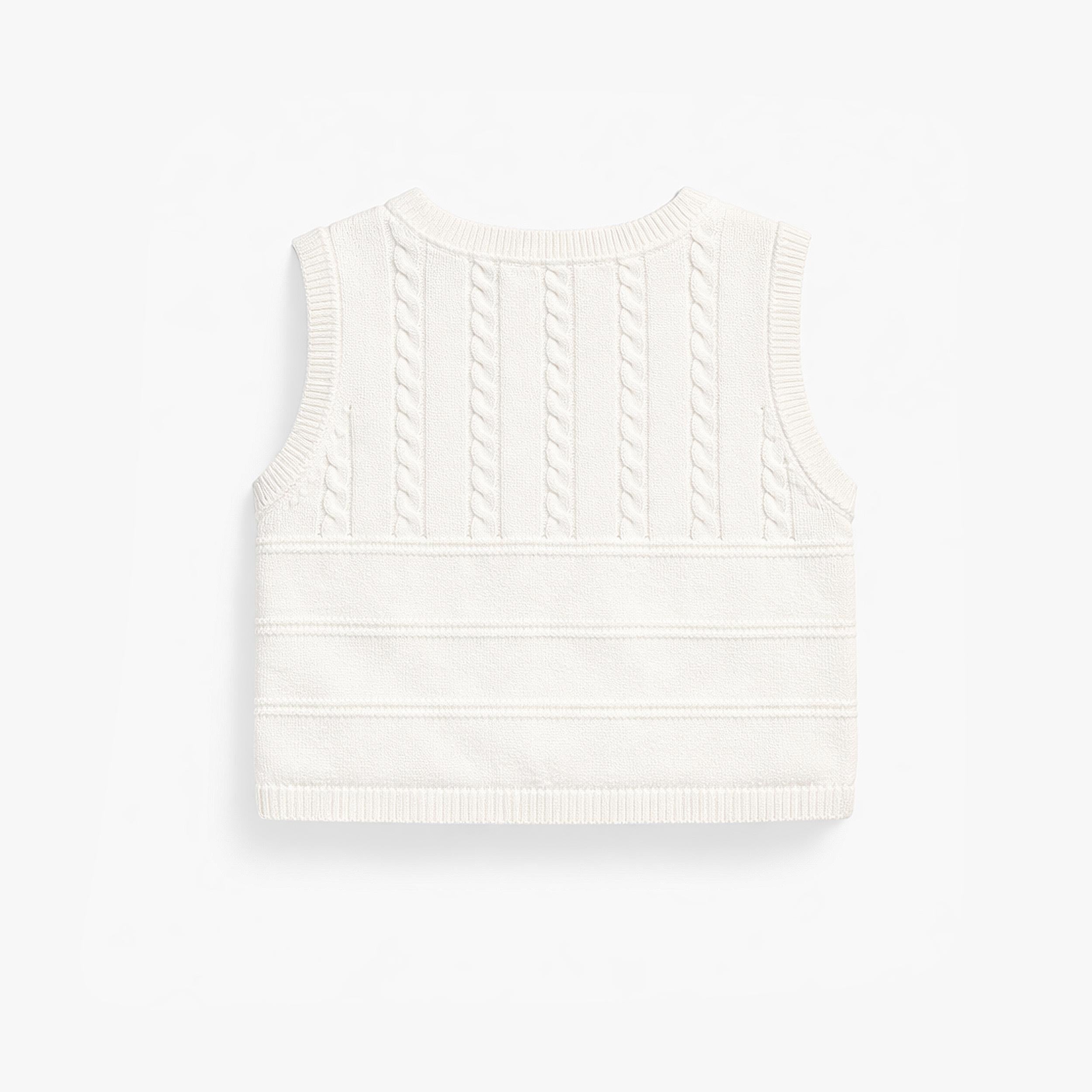 Dos du débardeur crème en tricot, naissance