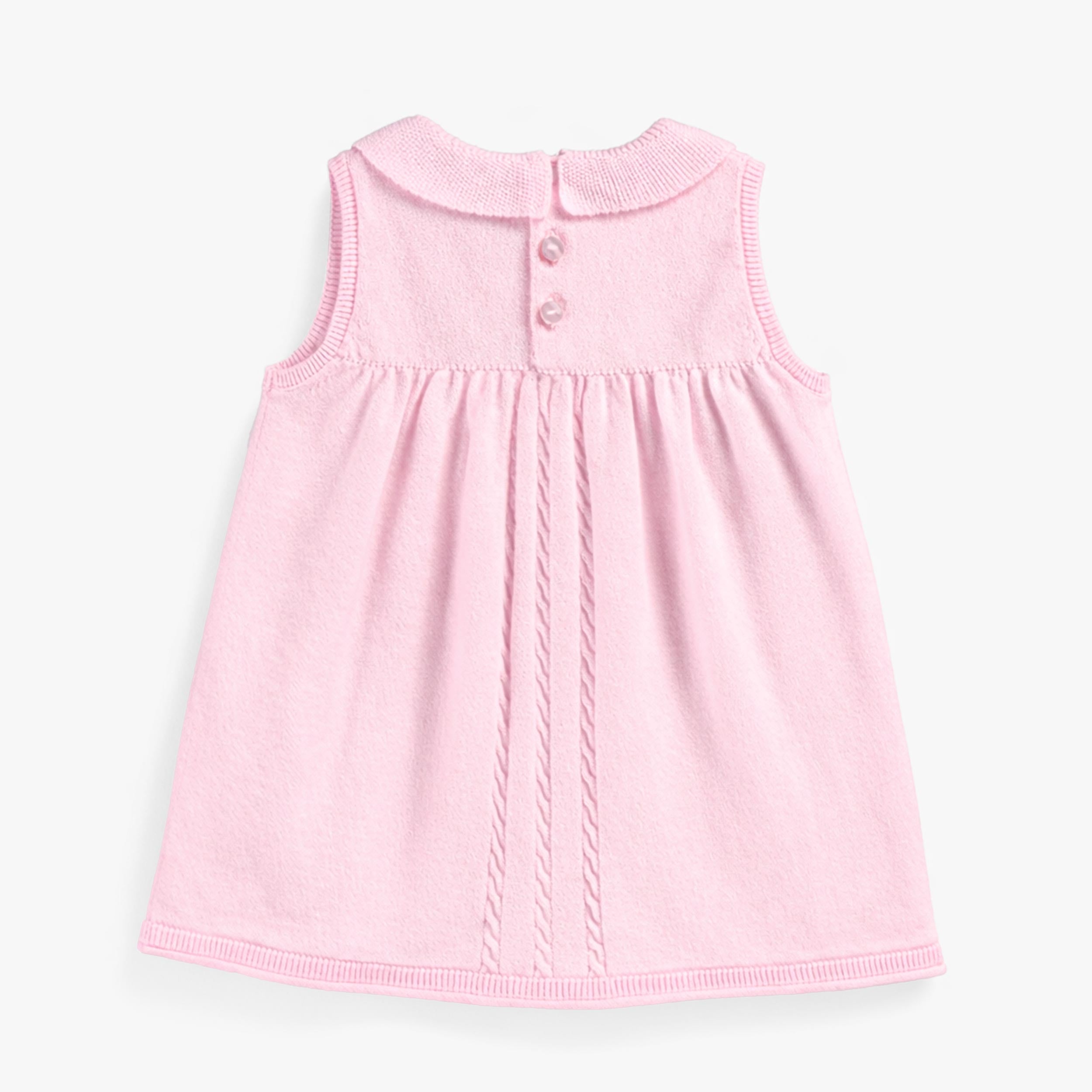 Dos de la robe rose en tricot, bébé