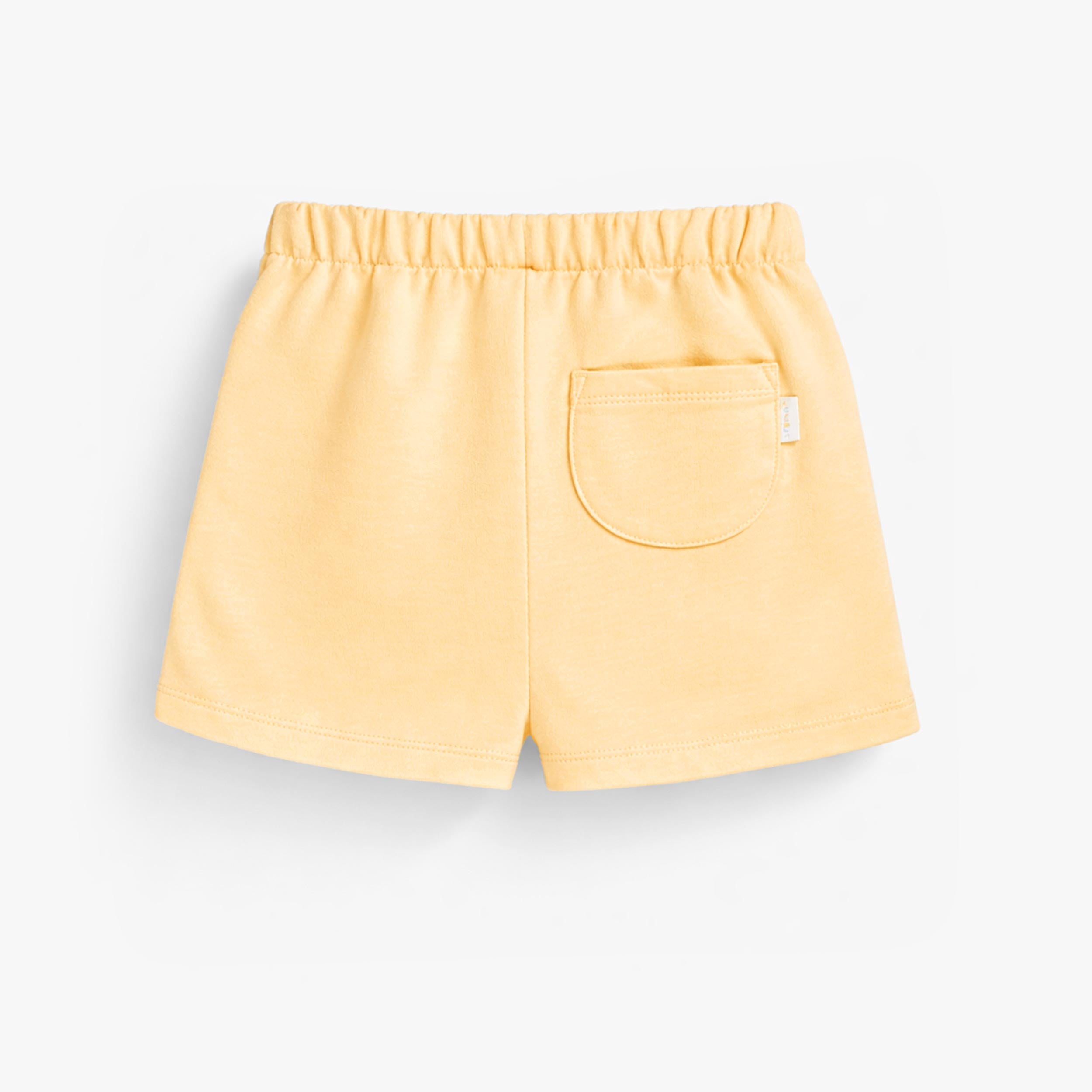 Dos du short jaune en tricot français, enfant
