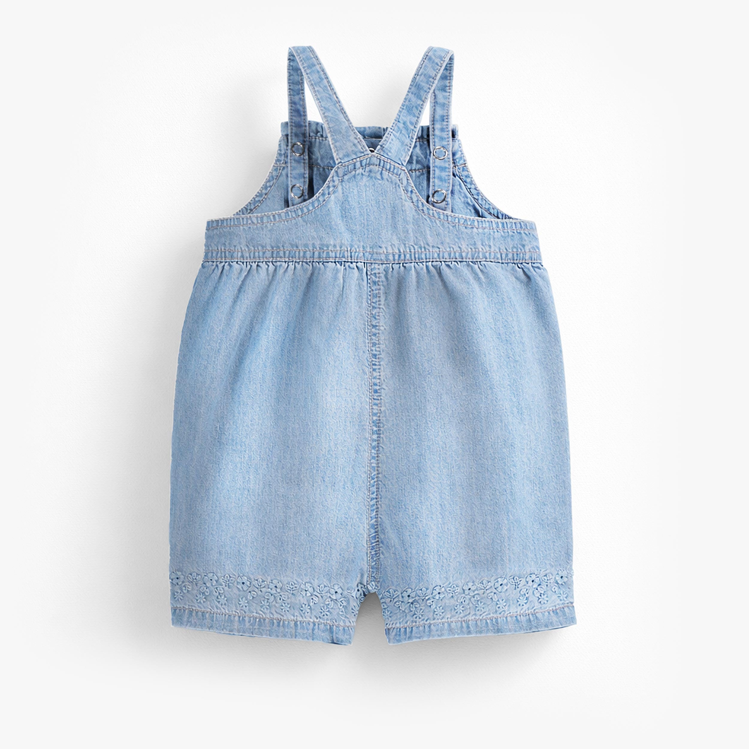 Dos de la salopette en denim léger, bébé