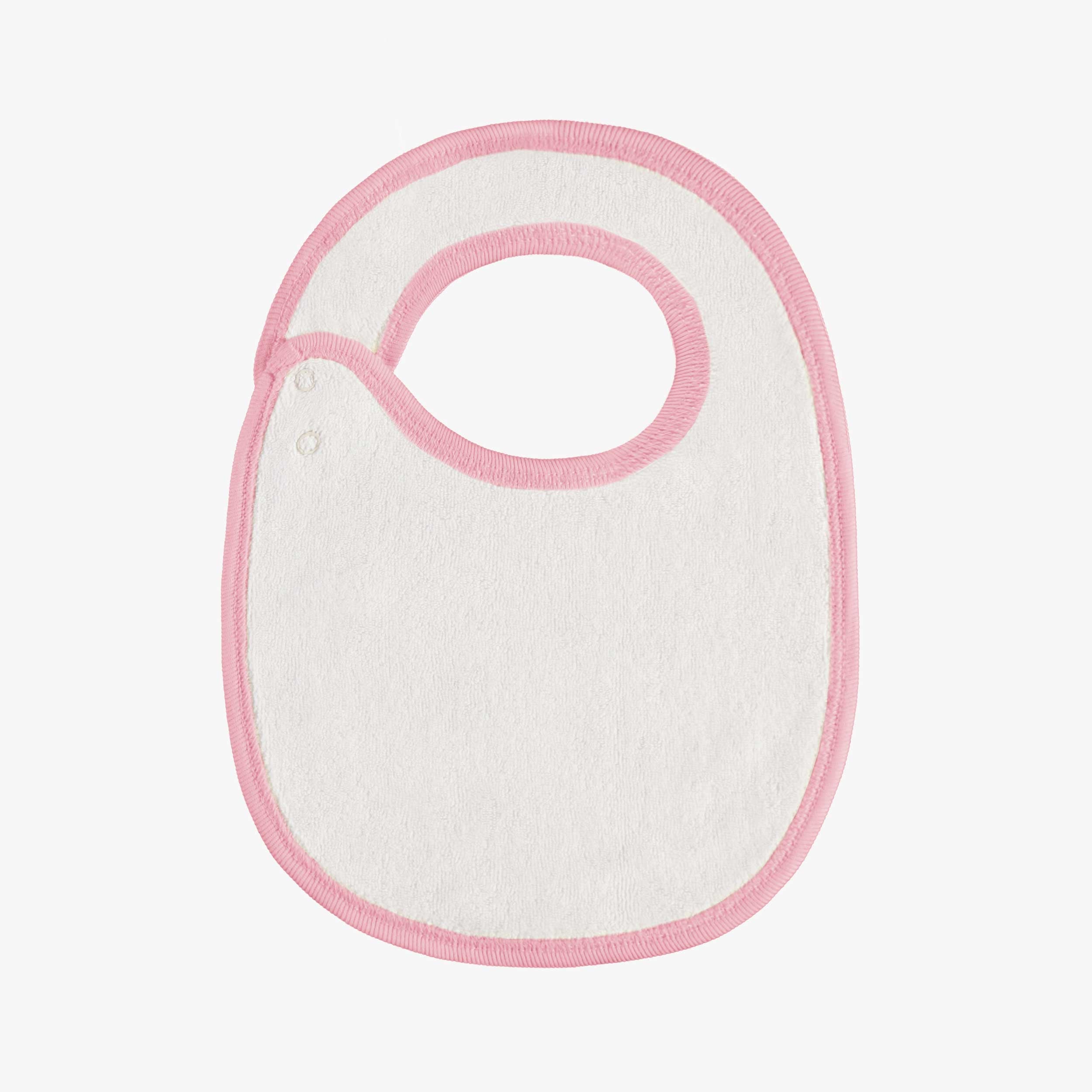 Dos du bavoir rose à motifs des Fêtes, naissance