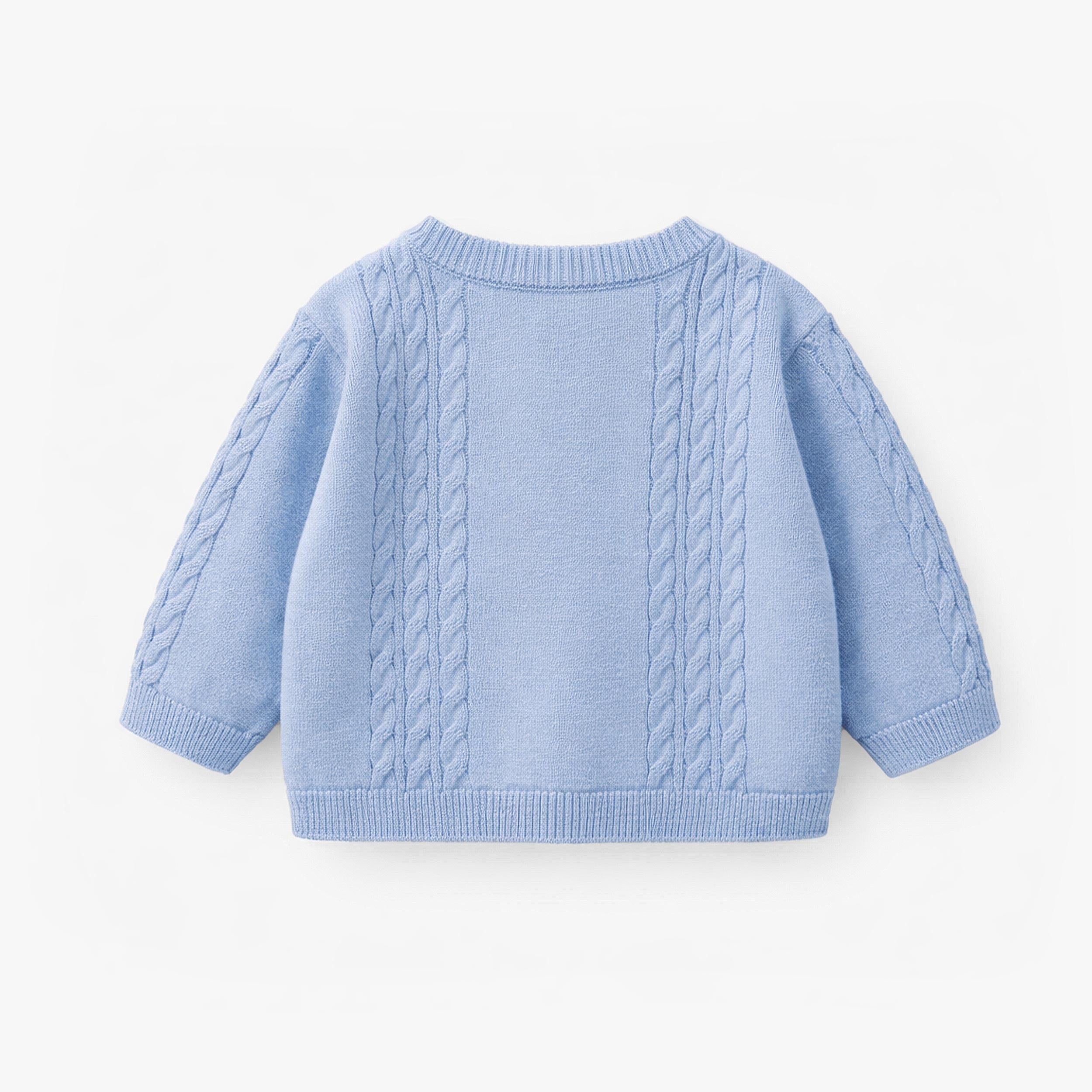 Dos du cardigan bleu en tricot, naissance