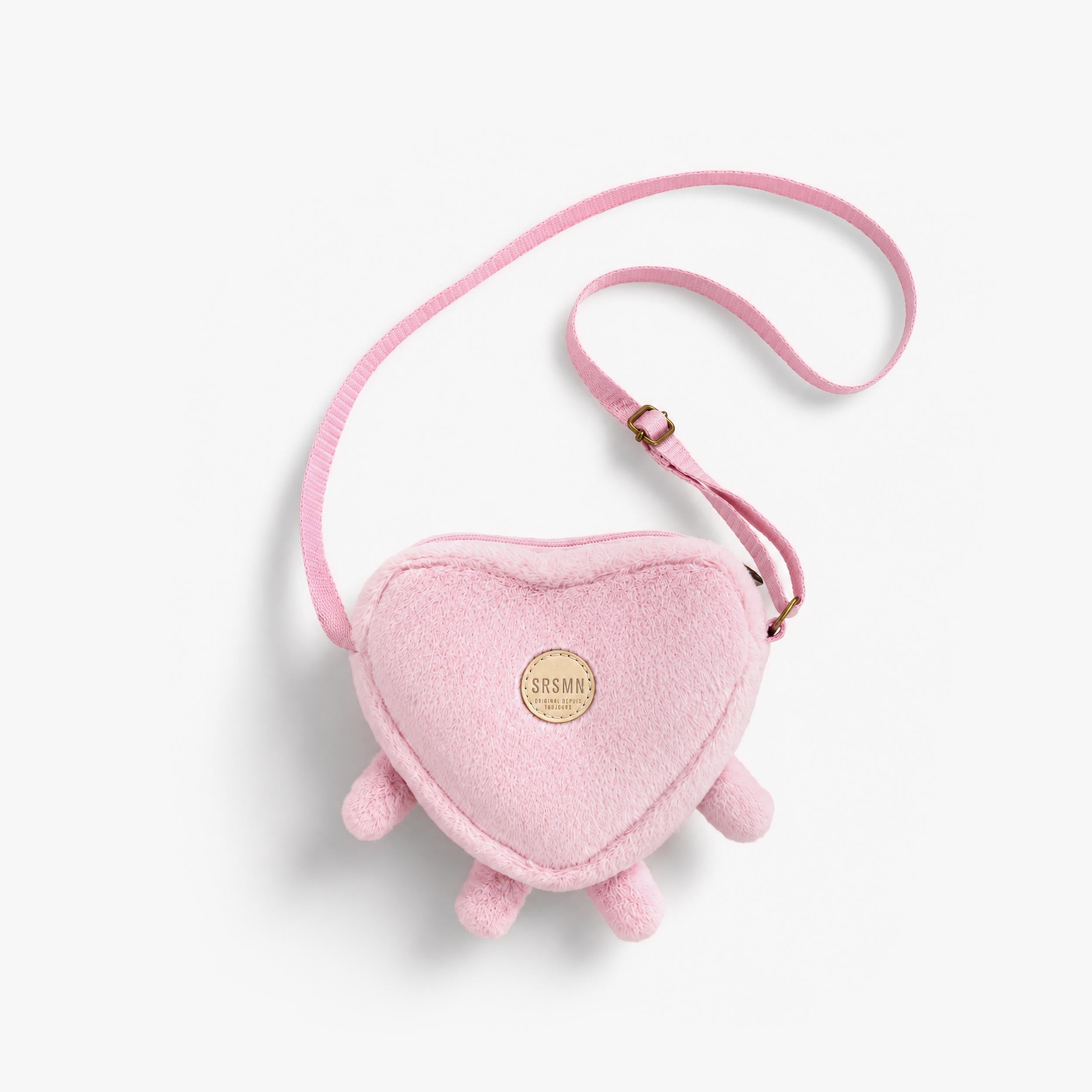 Dos du sac porte-feuille mauve en forme de cœur, enfant