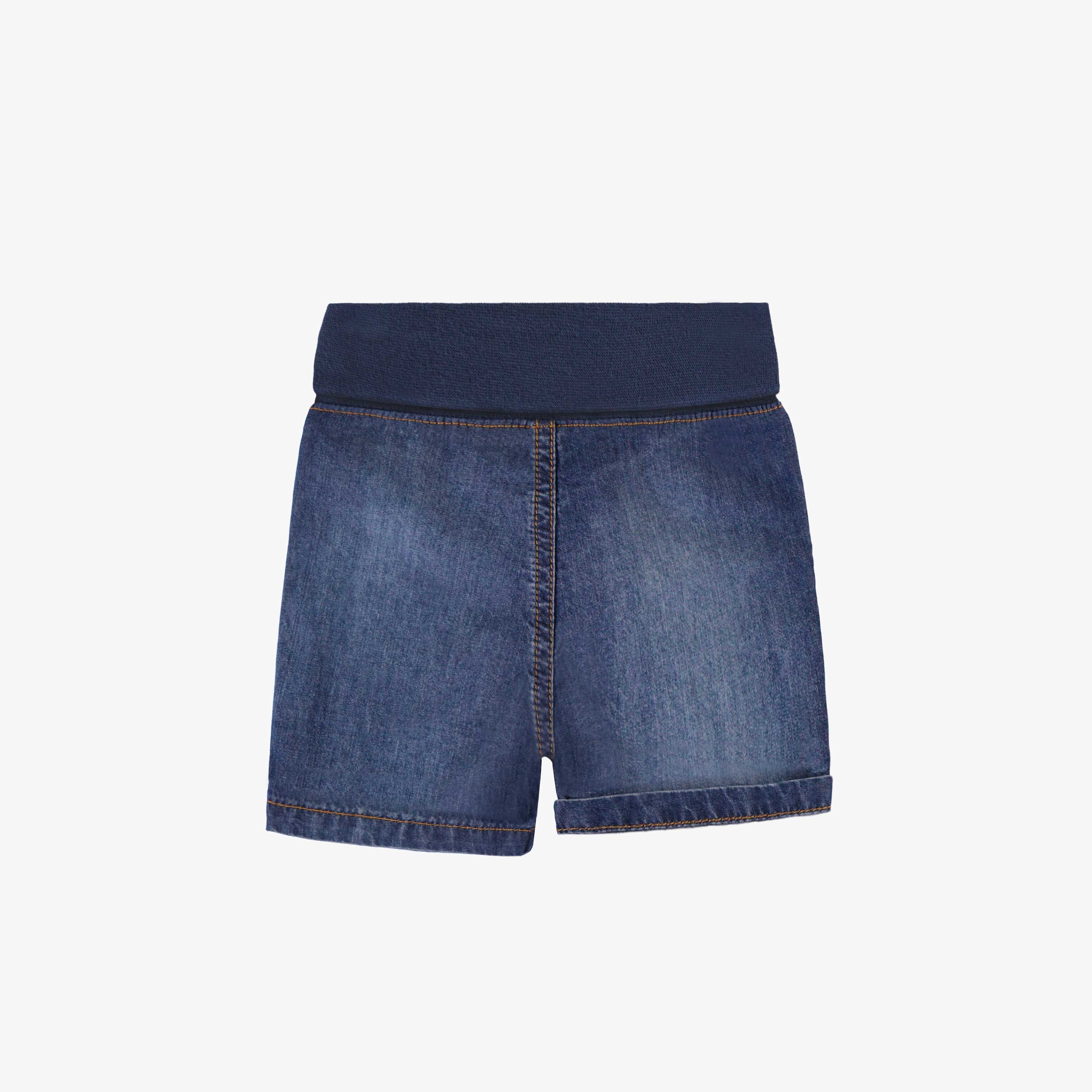 Dos du short en denim bleu à effet délavé, naissance