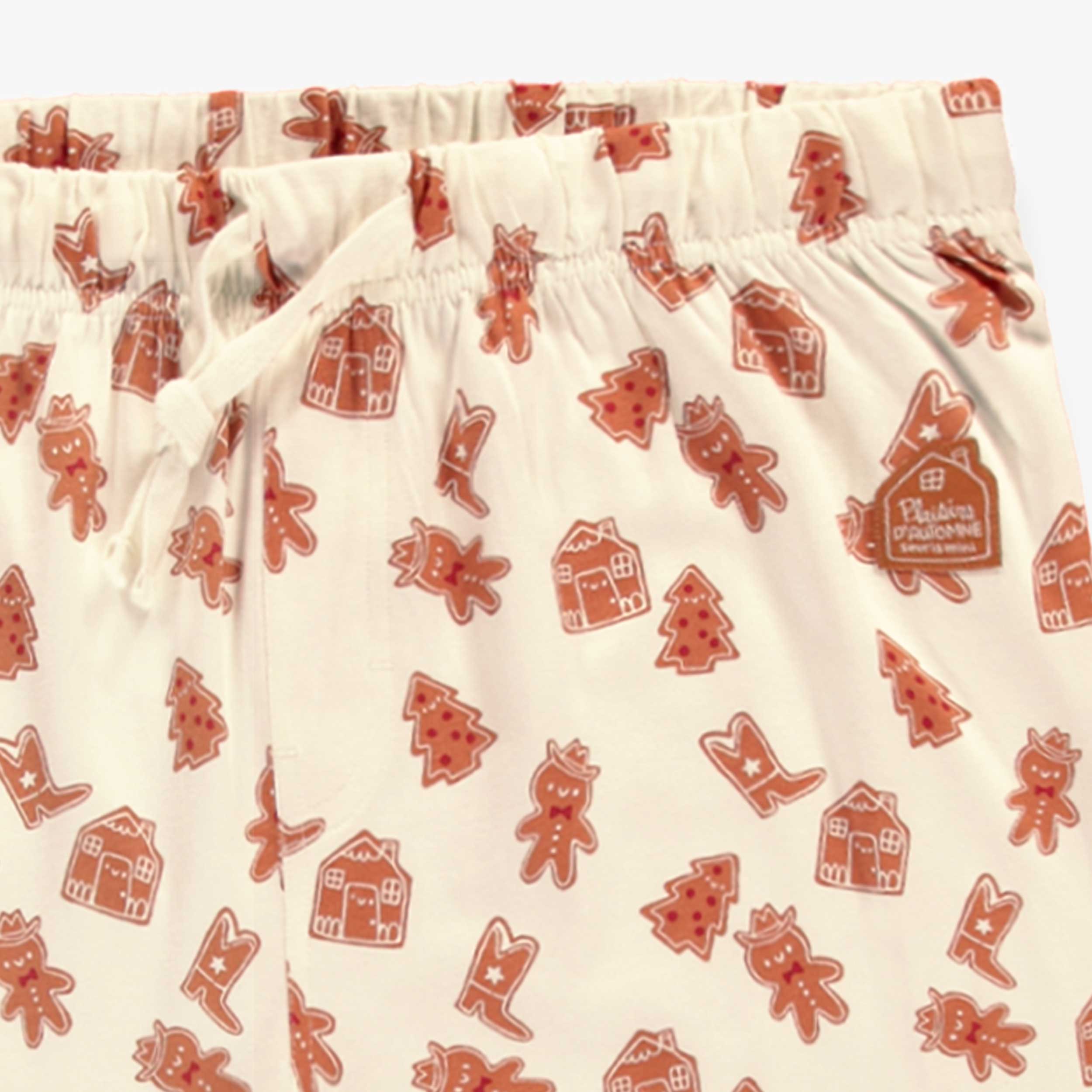 Zoom détails du pantalon de pyjama crème à motifs pain d’épices, adulte