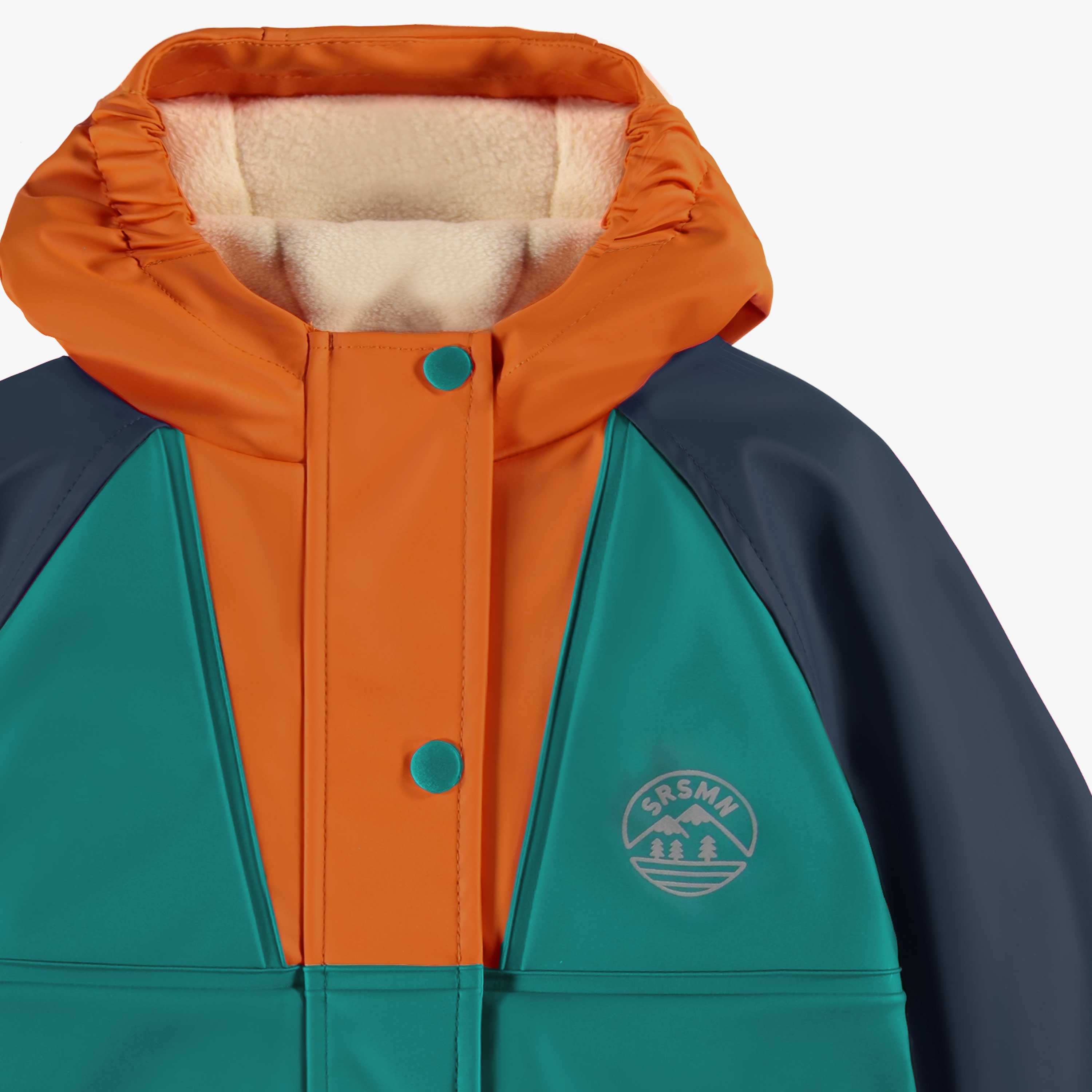 Zoom détails du manteau imperméable bleu, turquoise et orange, bébé