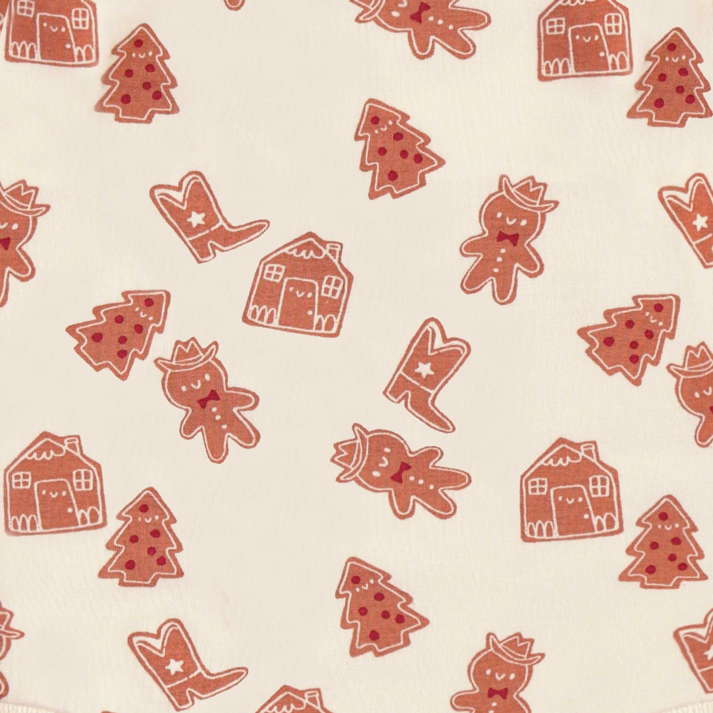Zoom détails du cache-couche crème à motifs pain d’épices, bébé