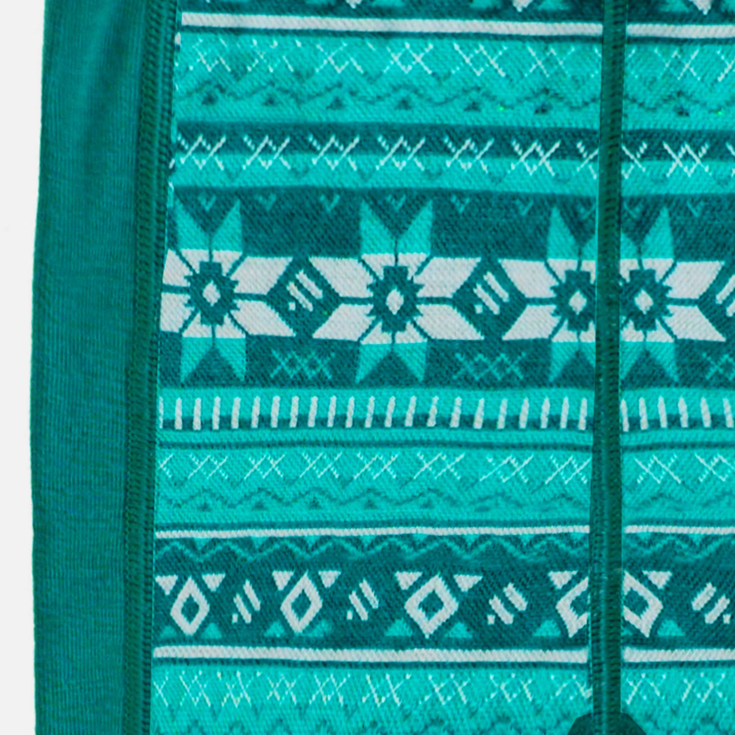 Zoom détails du legging turquoise en laine mérinos avec motifs jacquard, bébé