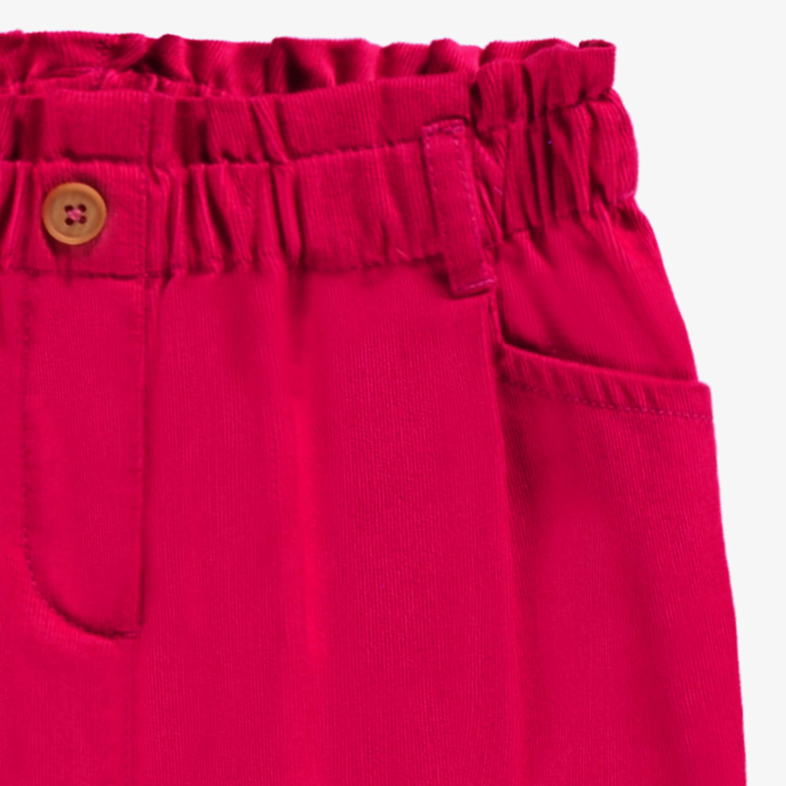Zoom détail du pantalon rose en velours côtelé, enfant
