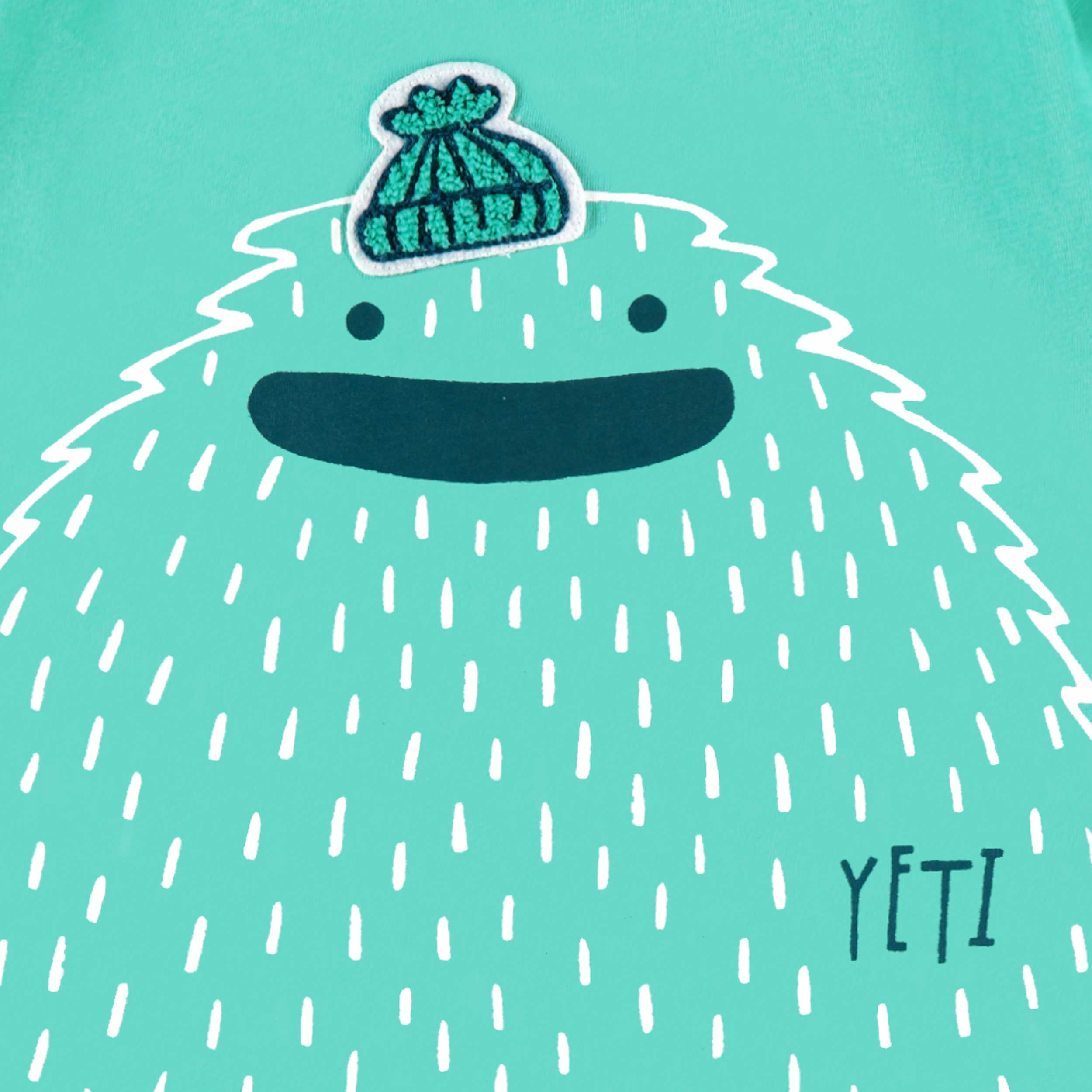 Zoom détails du t-shirt turquoise avec illustration, enfant