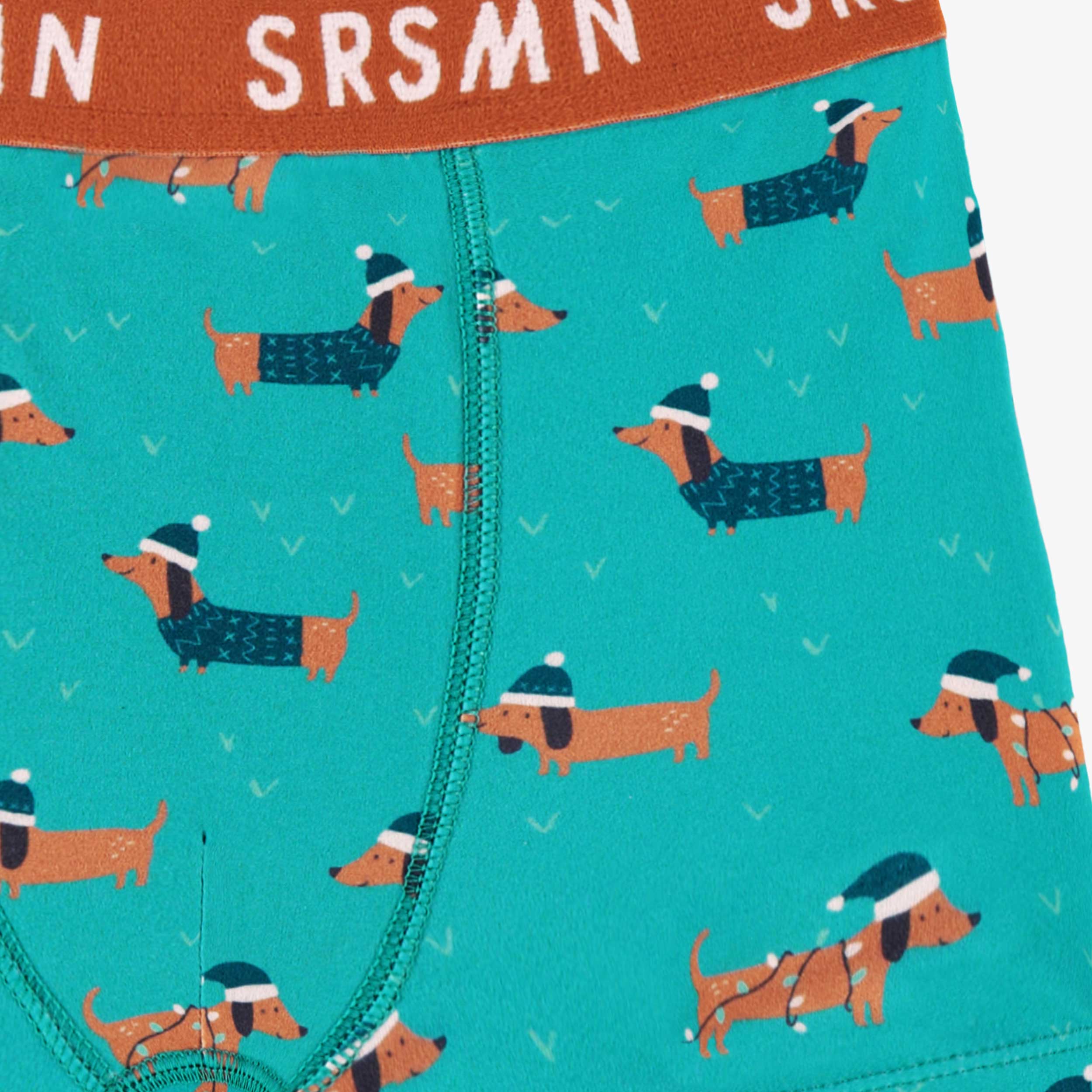 Zoom détails du boxer turquoise à motifs de chiens, enfant