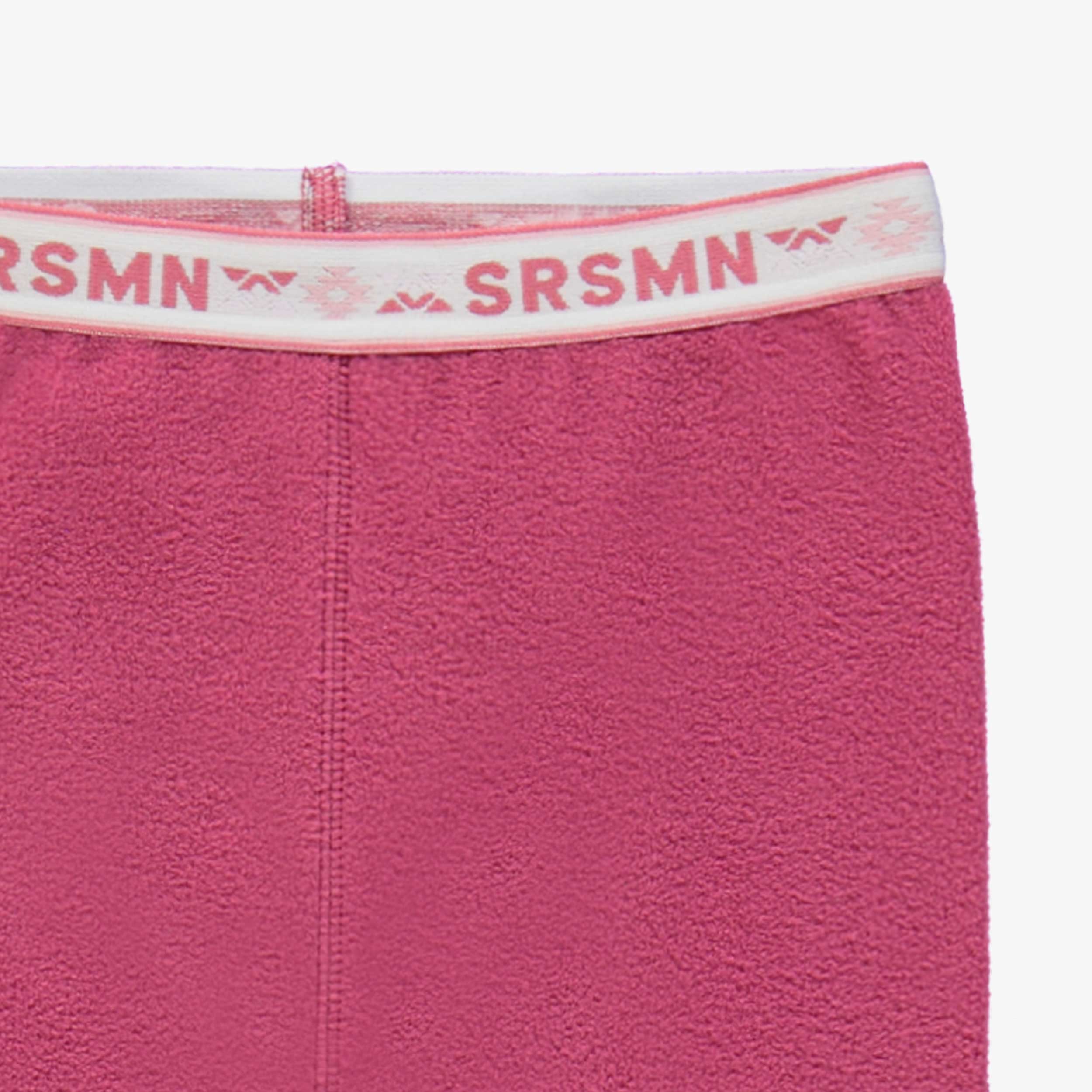 Zoom détails du pantalon rose en polar, enfant