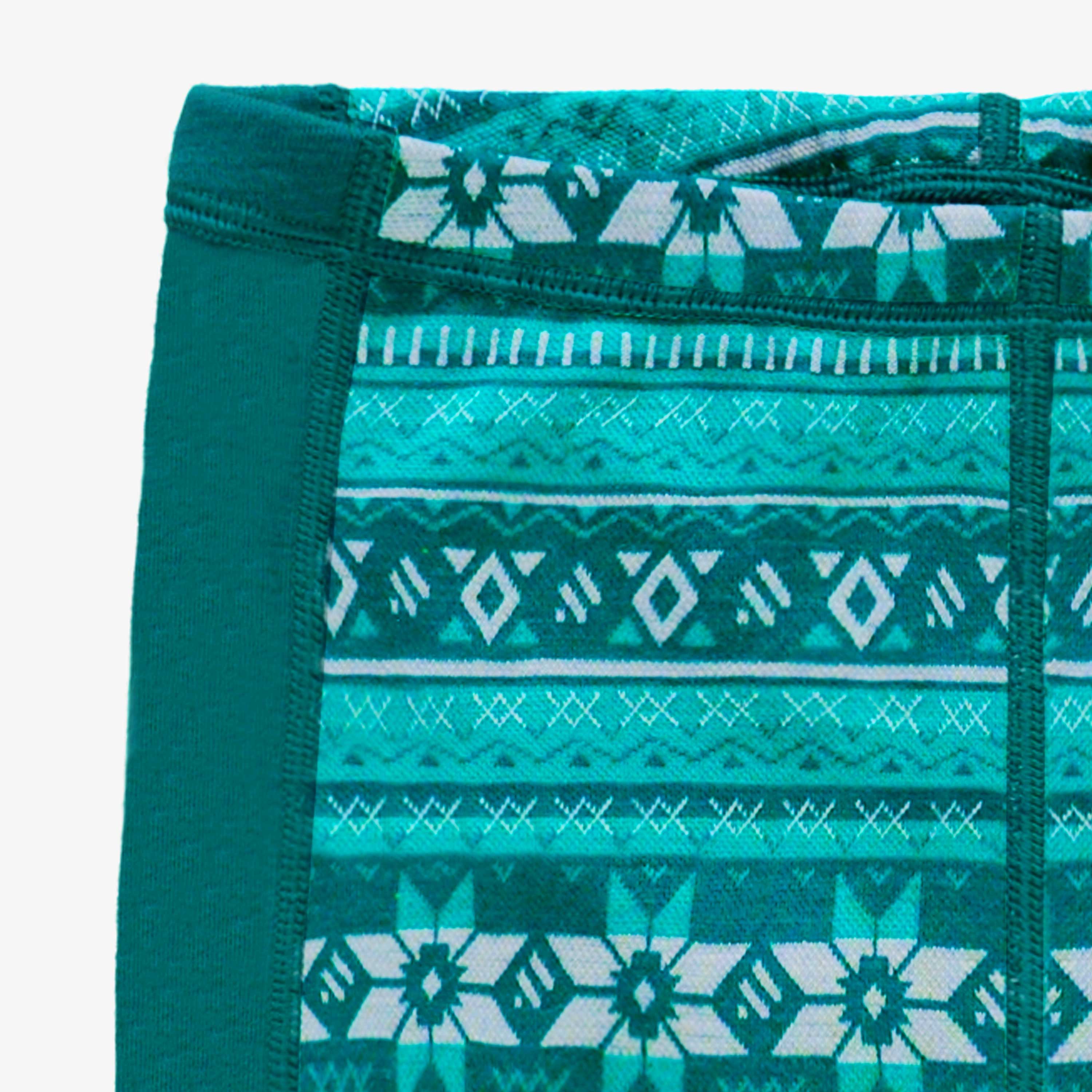 Zoom détails du legging turquoise en laine mérinos avec motifs jacquard, enfant