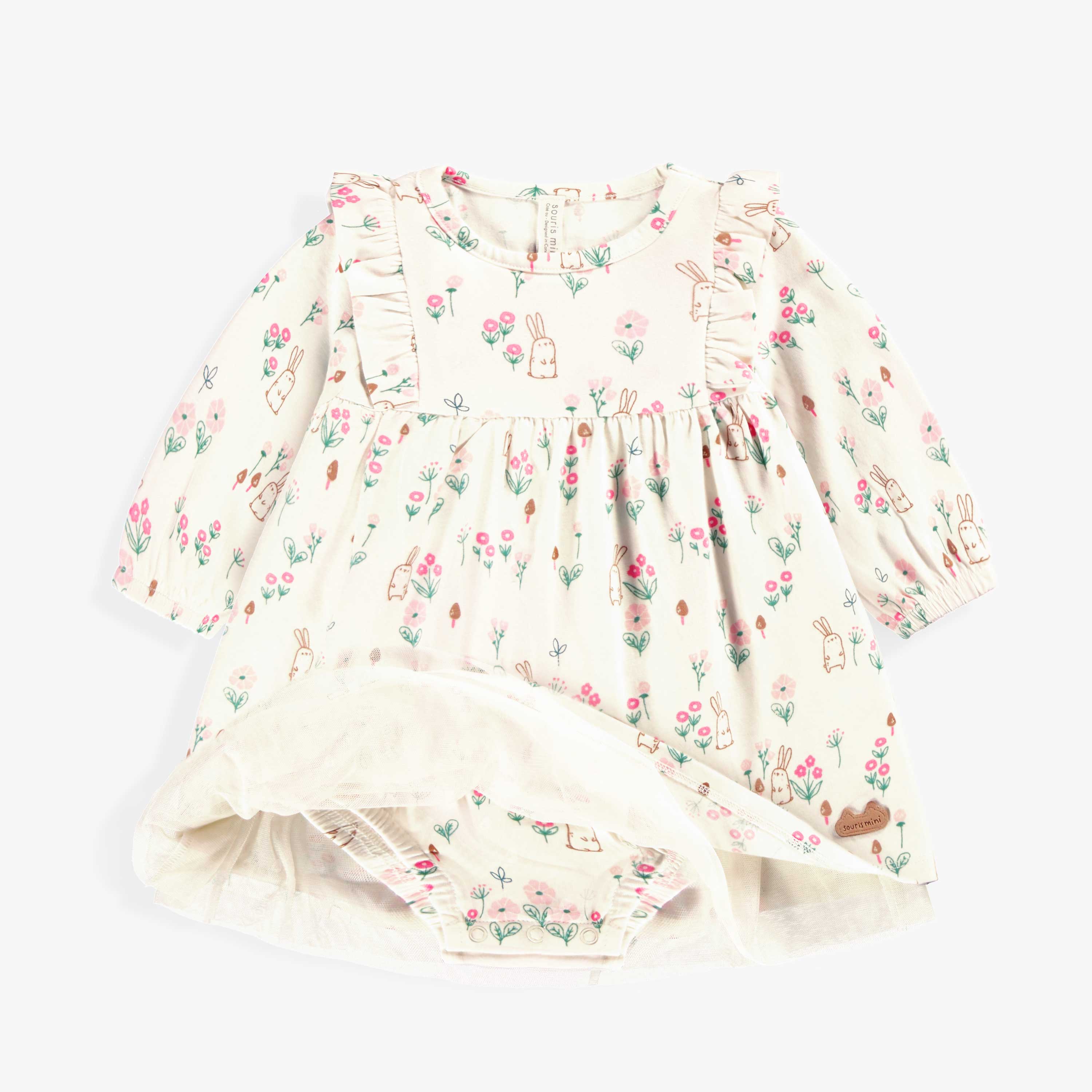 Détails de la robe crème à motifs, naissance