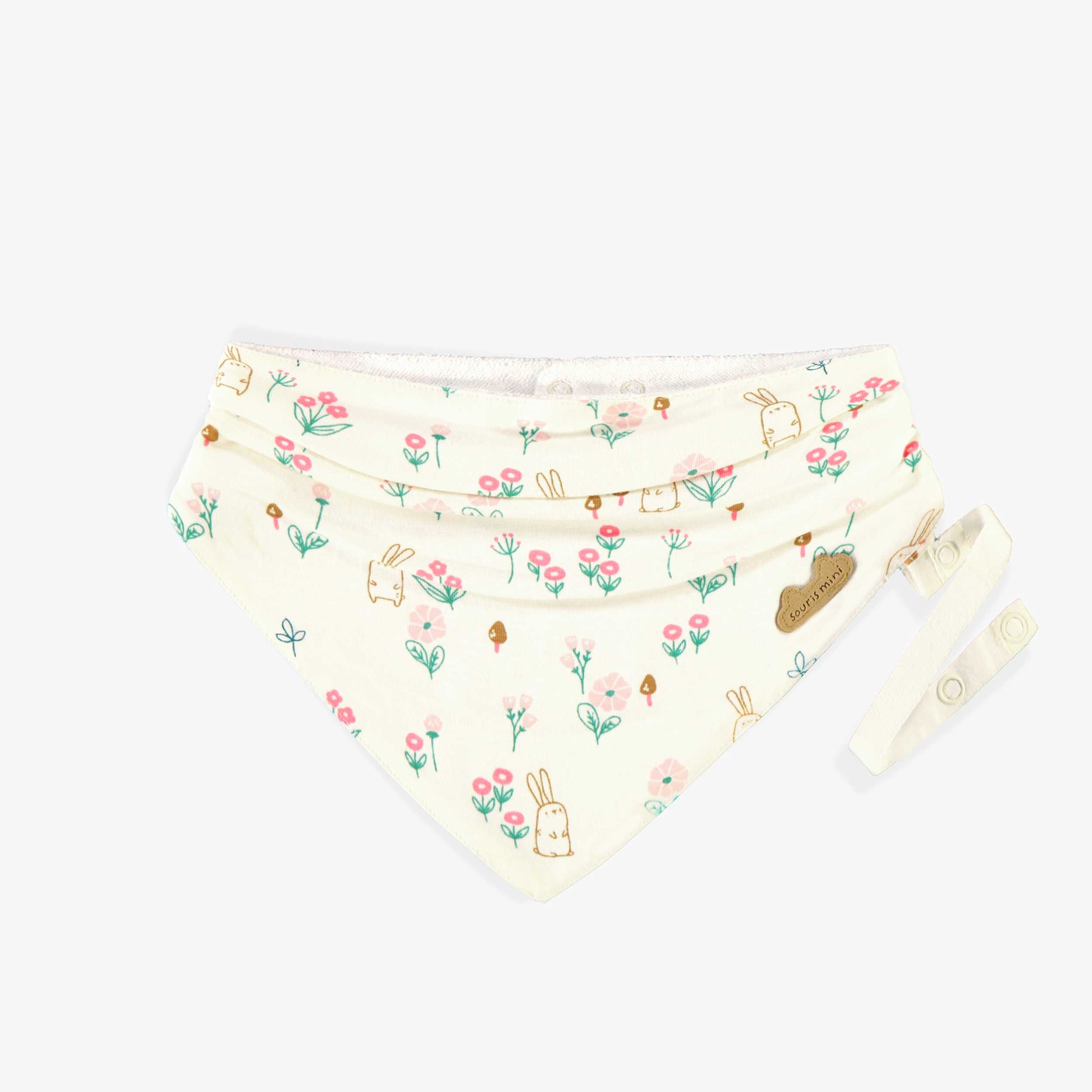 Bavoir crème à motifs, naissance