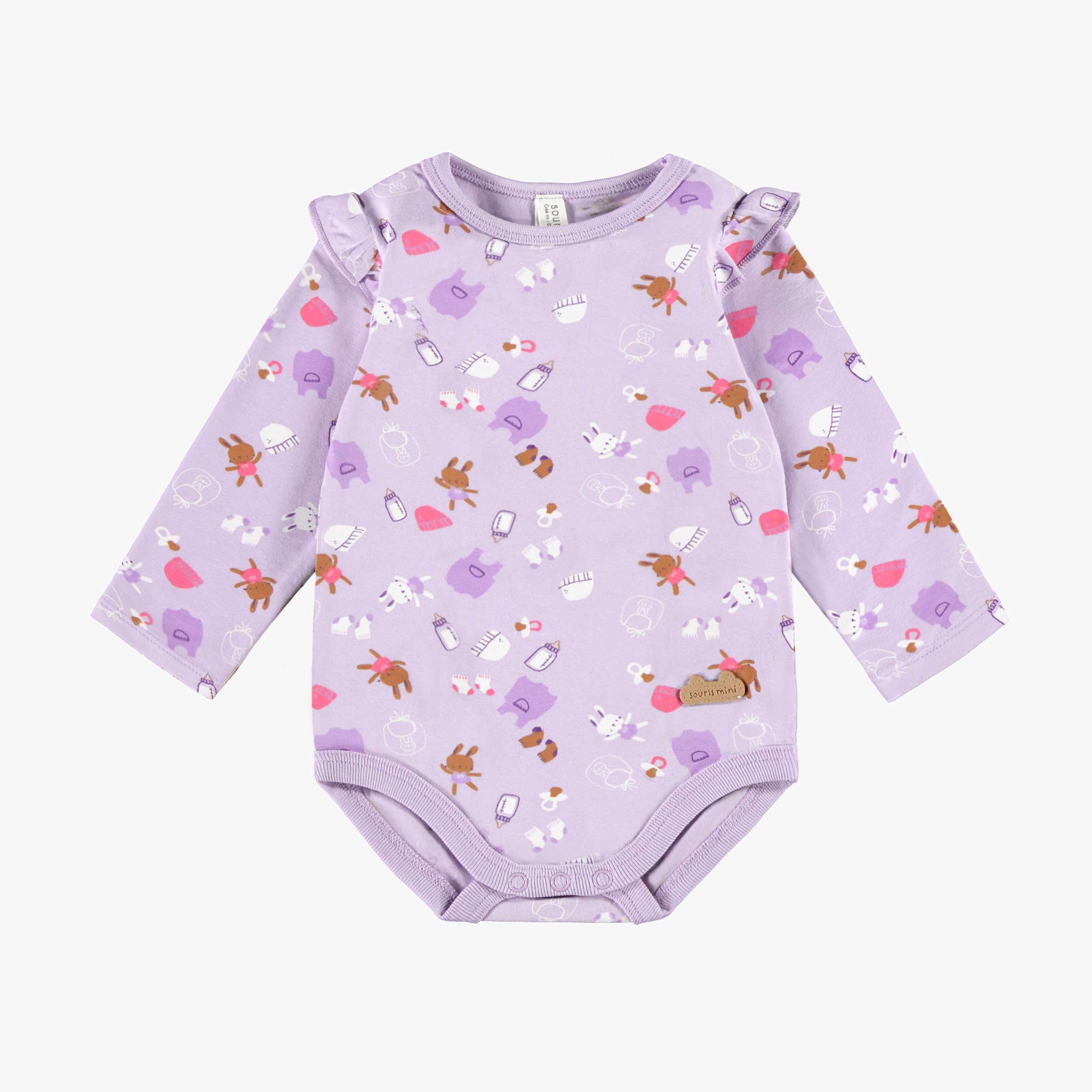 Cache-couche mauve à motifs, naissance