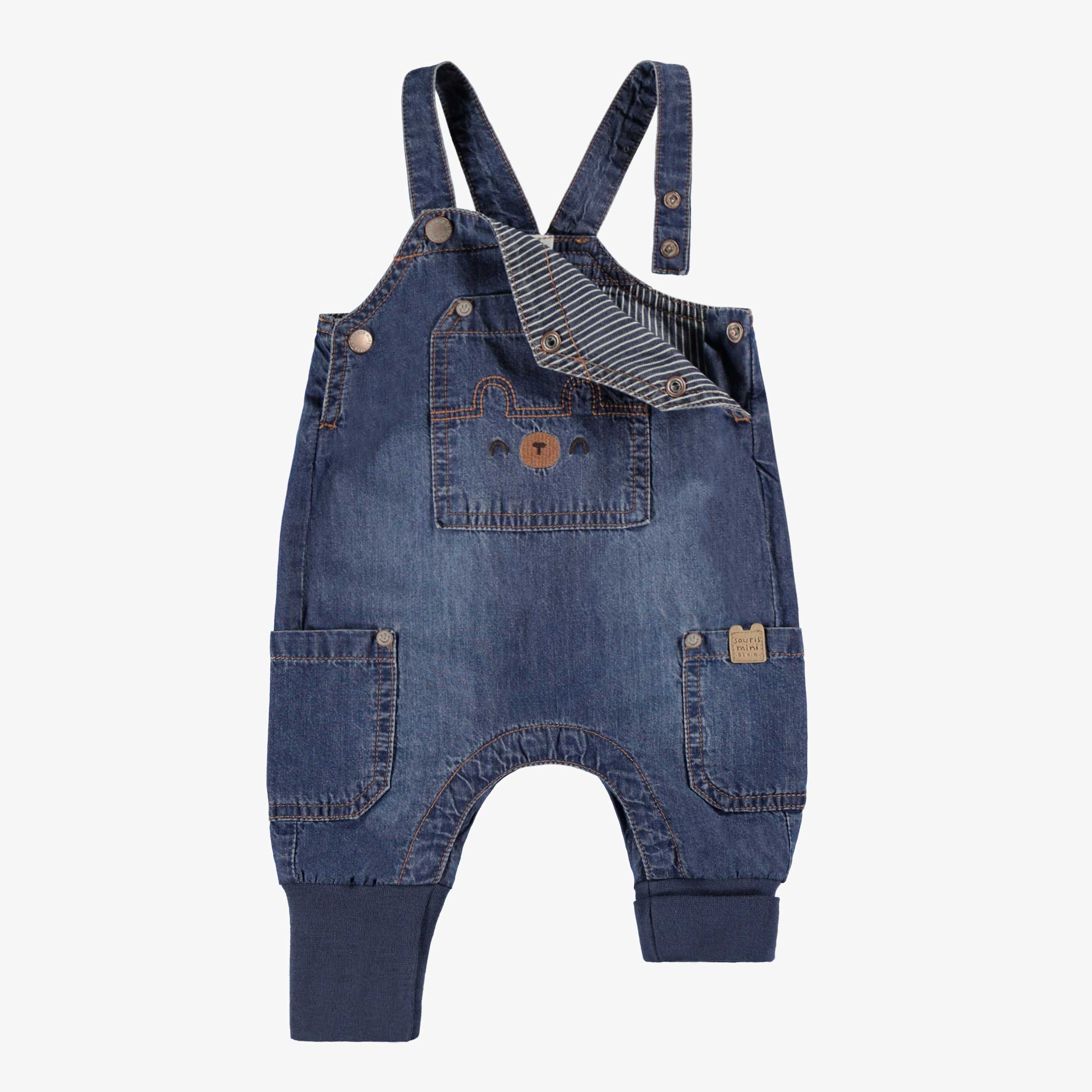 Zoom détails de la salopette bleue en denim, naissance