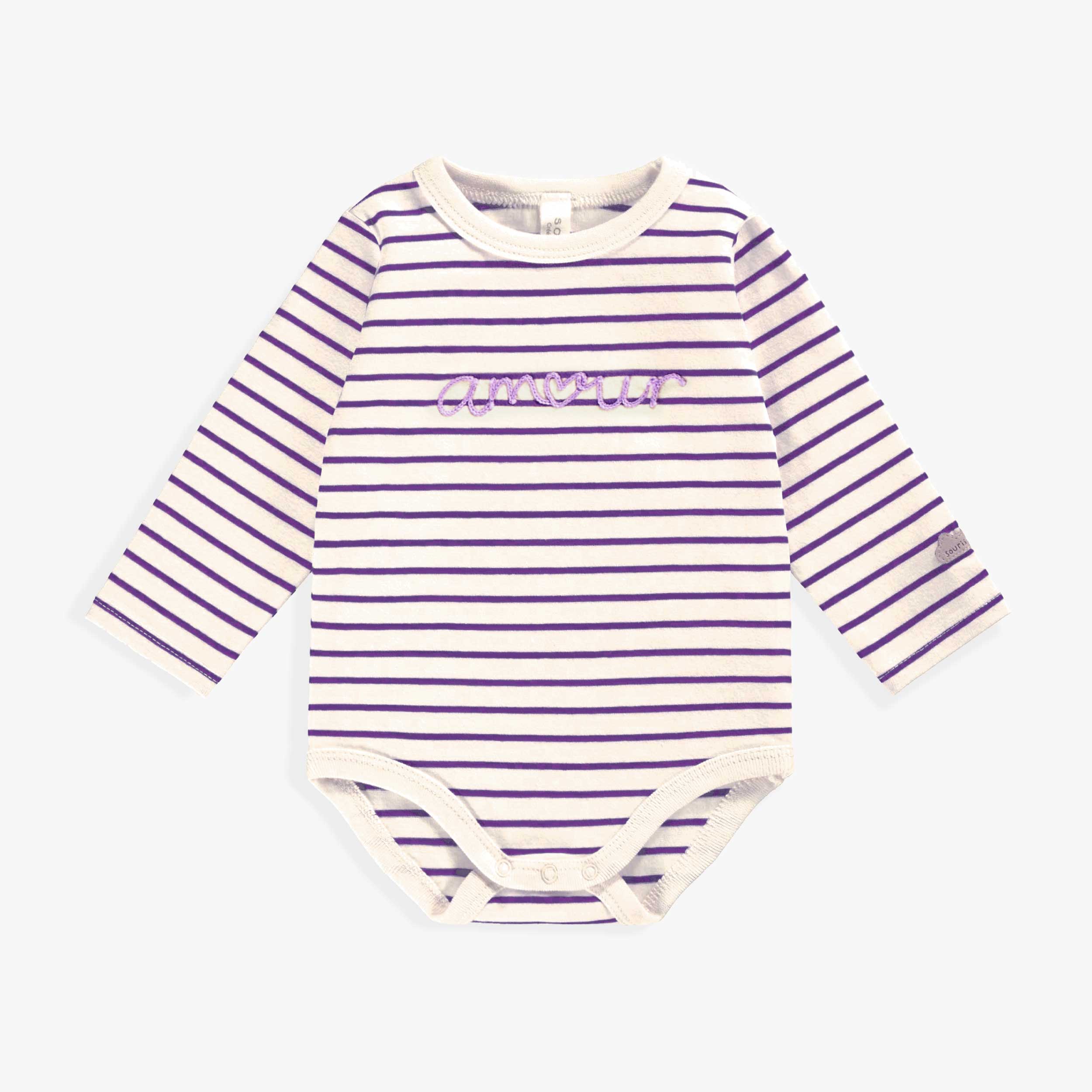 Cache-couche crème à rayures mauves, naissance