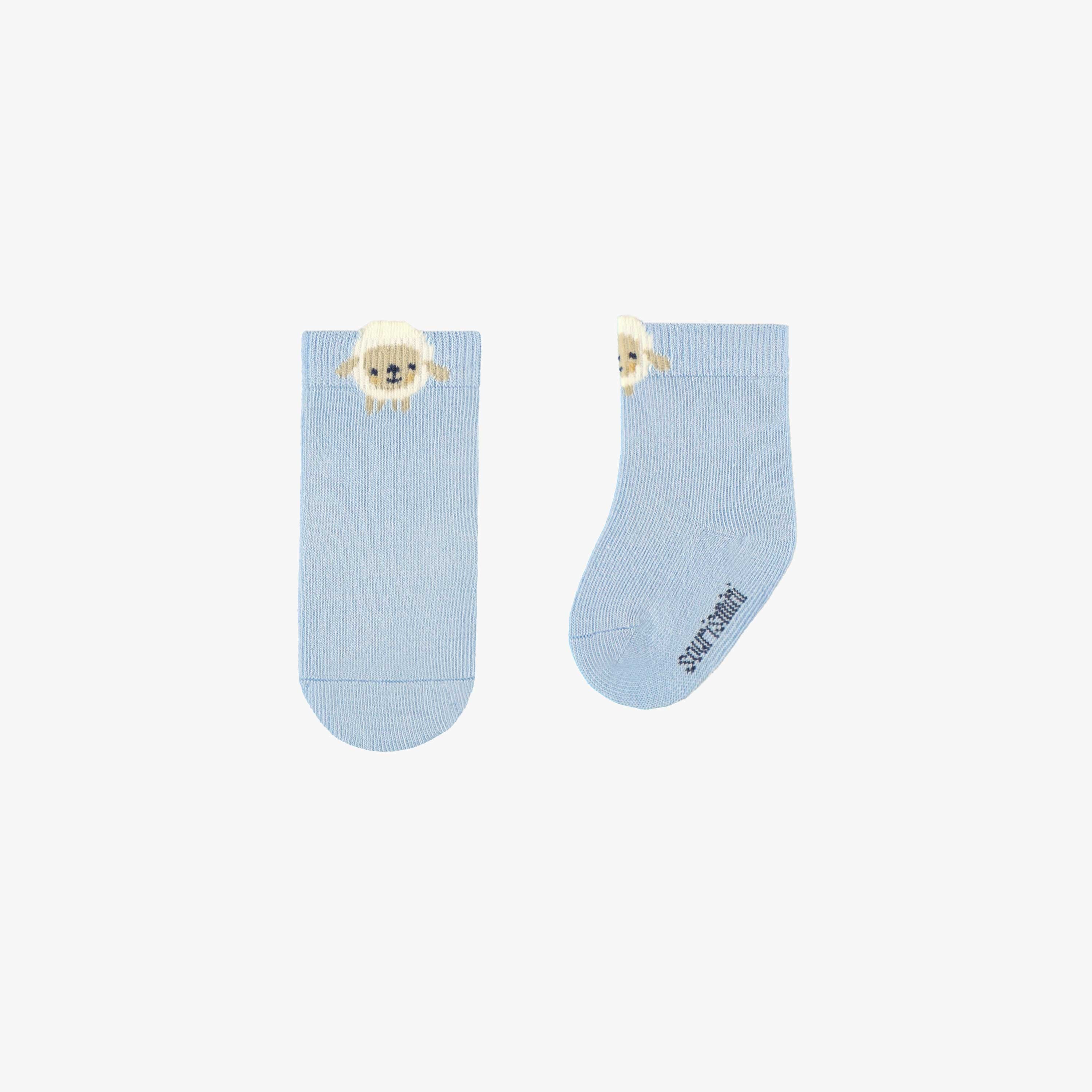Chaussettes bleues avec mouton, naissance