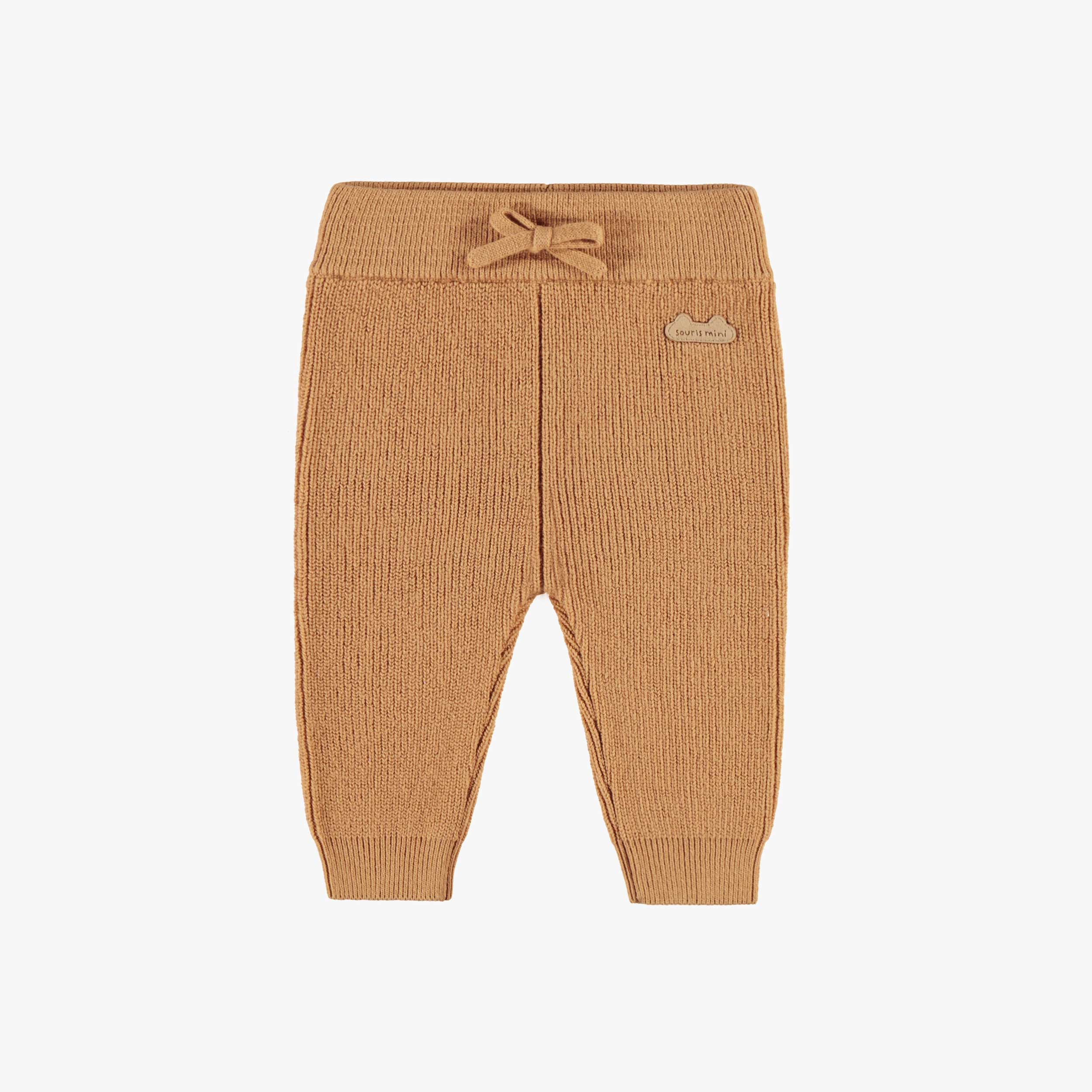 Pantalon beige en tricot, naissance