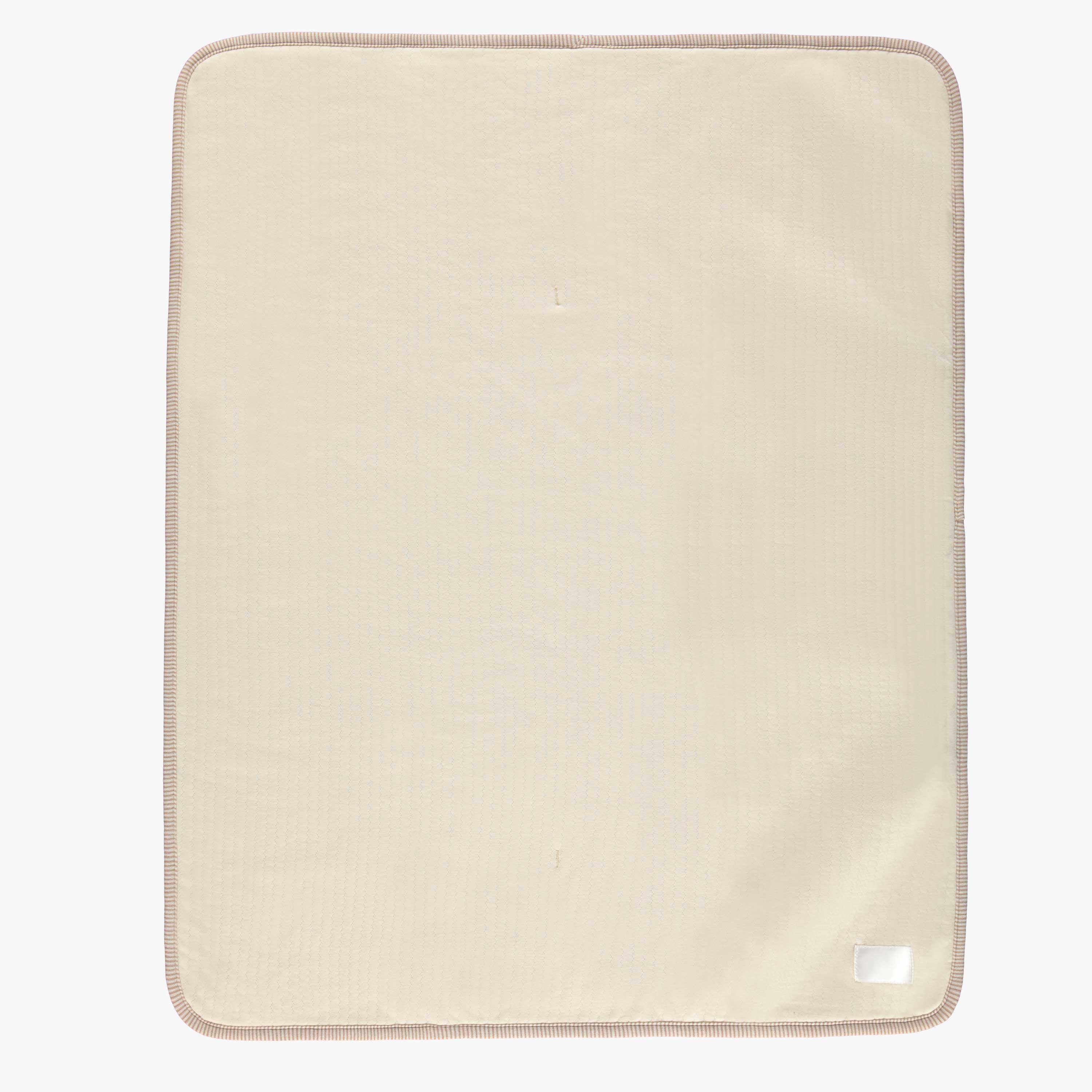 Revers de la couverture crème en sherpa