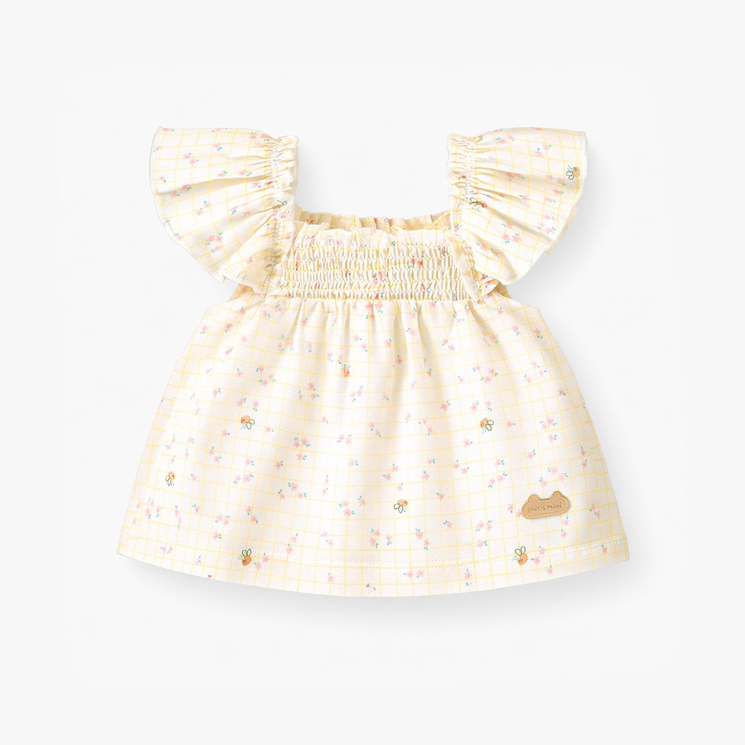 Haut de l'ensemble deux pièces crème à carreaux et motif floral, naissance