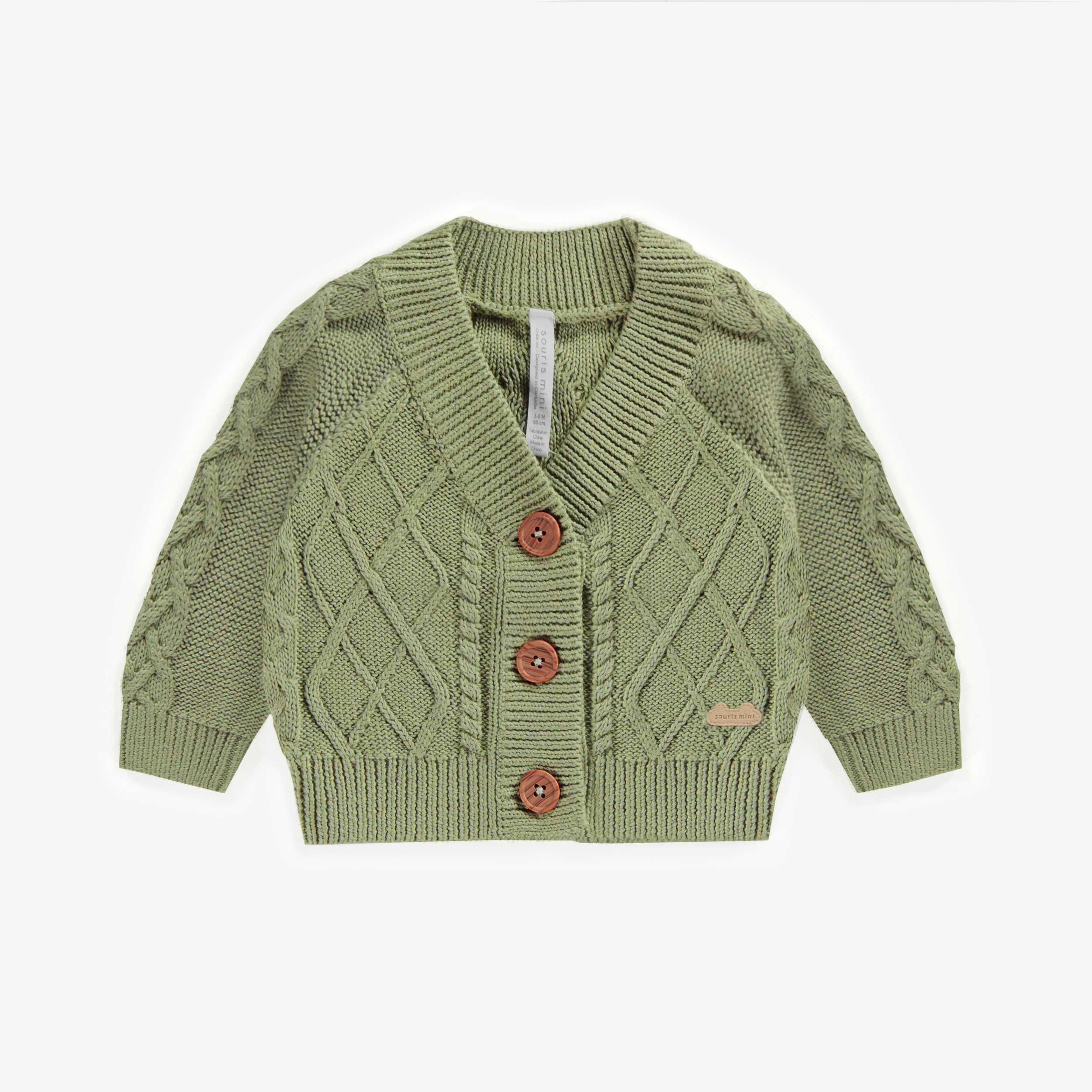 Veste de maille verte tressée, naissance