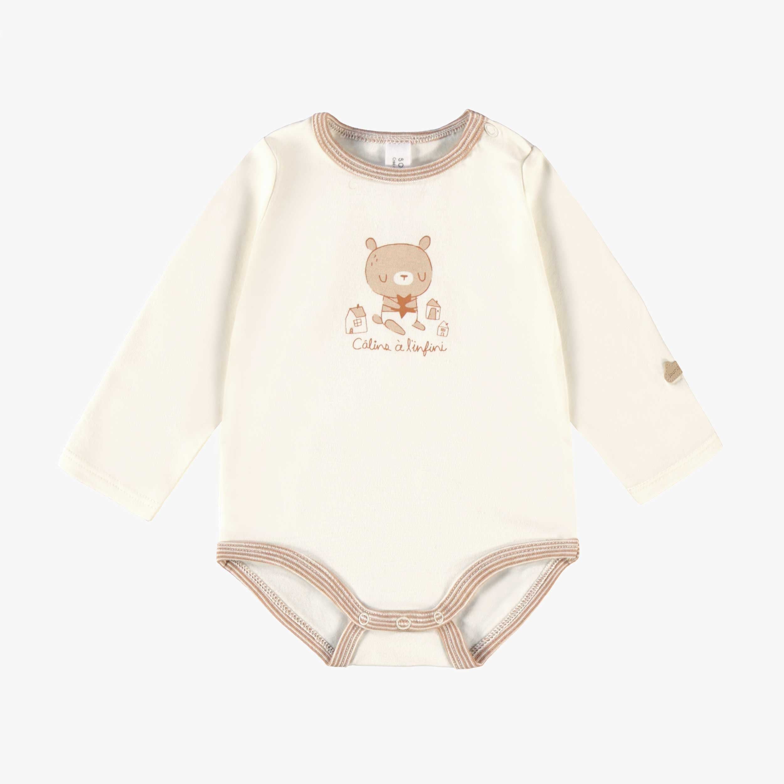 Cache-couche blanc de l’ensemble de deux cache-couches beige et crème, naissance