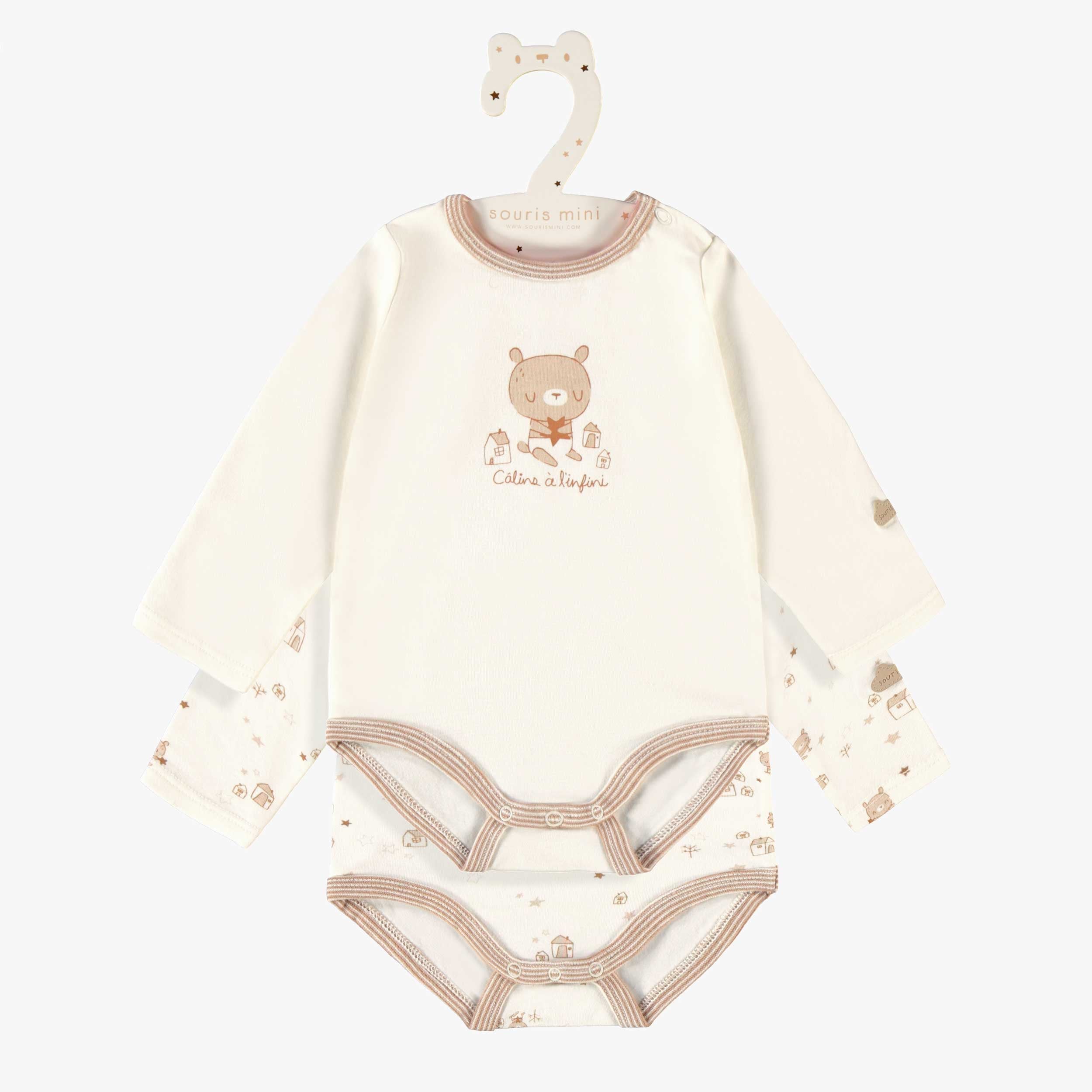 L’ensemble de deux cache-couches beige et crème, naissance