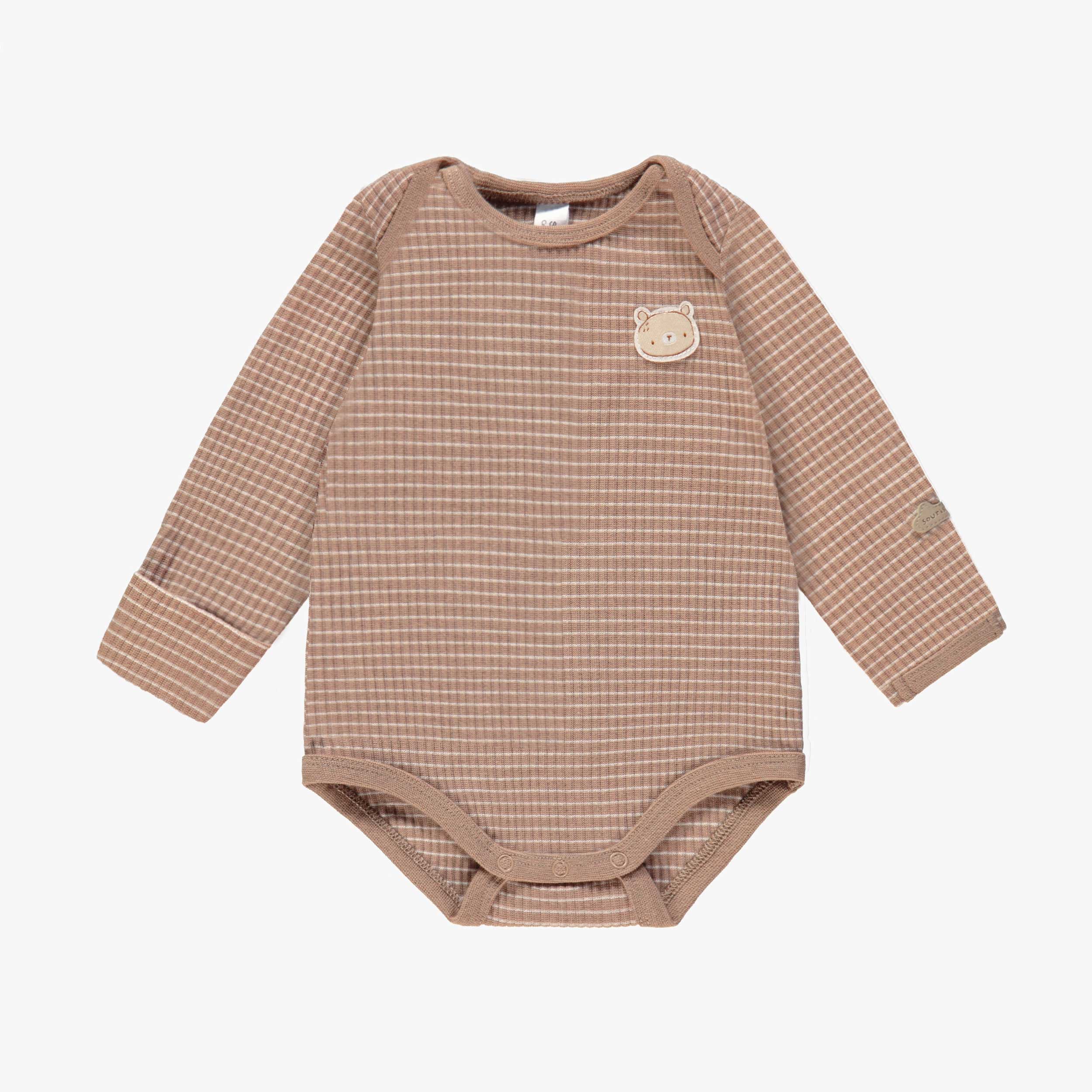 Cache-couche de l’ensemble cache-couche, pantalon et bonnet beige, naissance