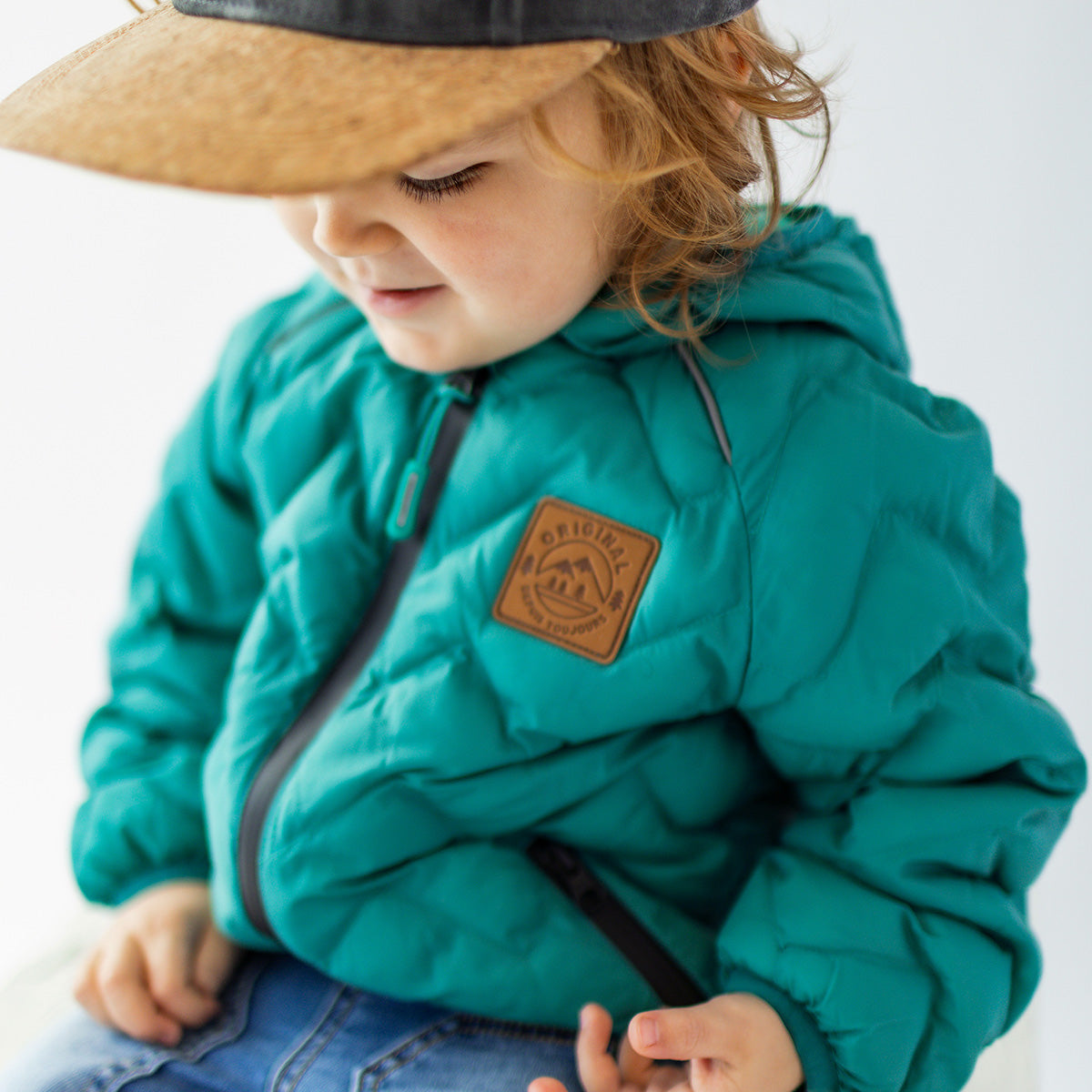 Turquoise puffer jacket with chevron quilting, baby