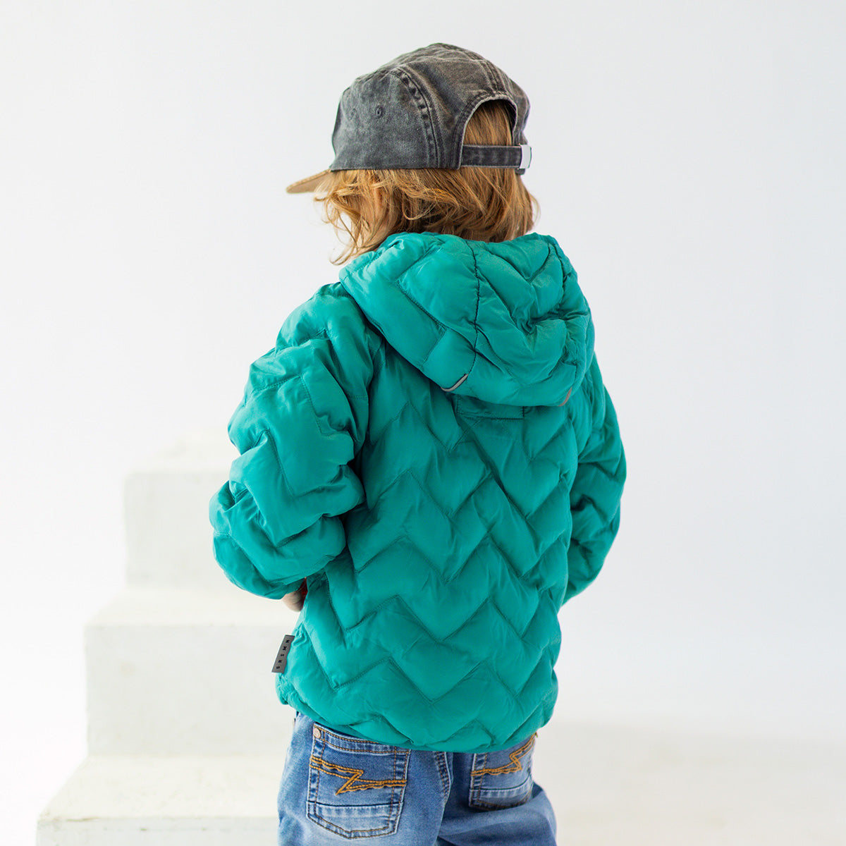 Turquoise puffer jacket with chevron quilting, baby
