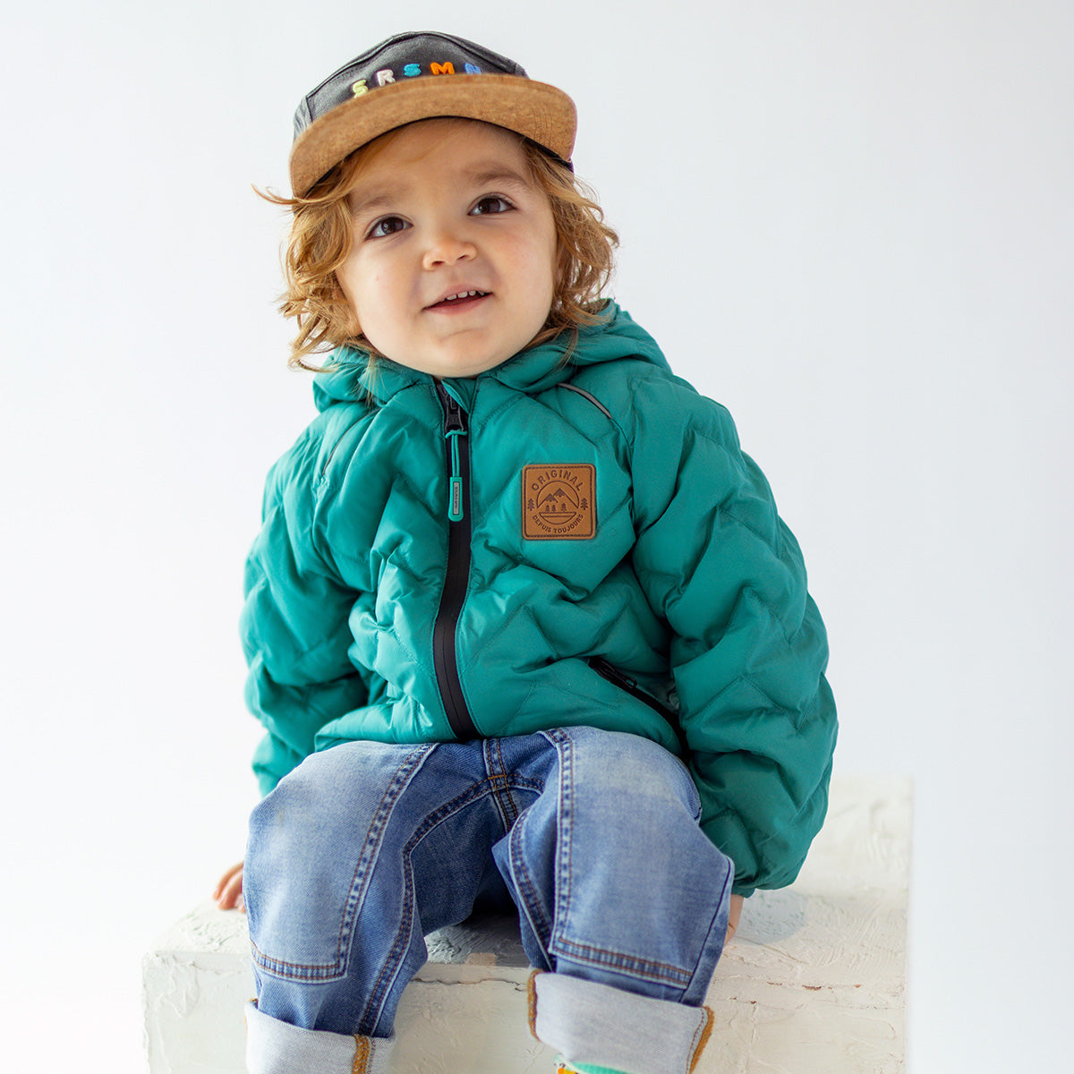 Turquoise puffer jacket with chevron quilting, baby