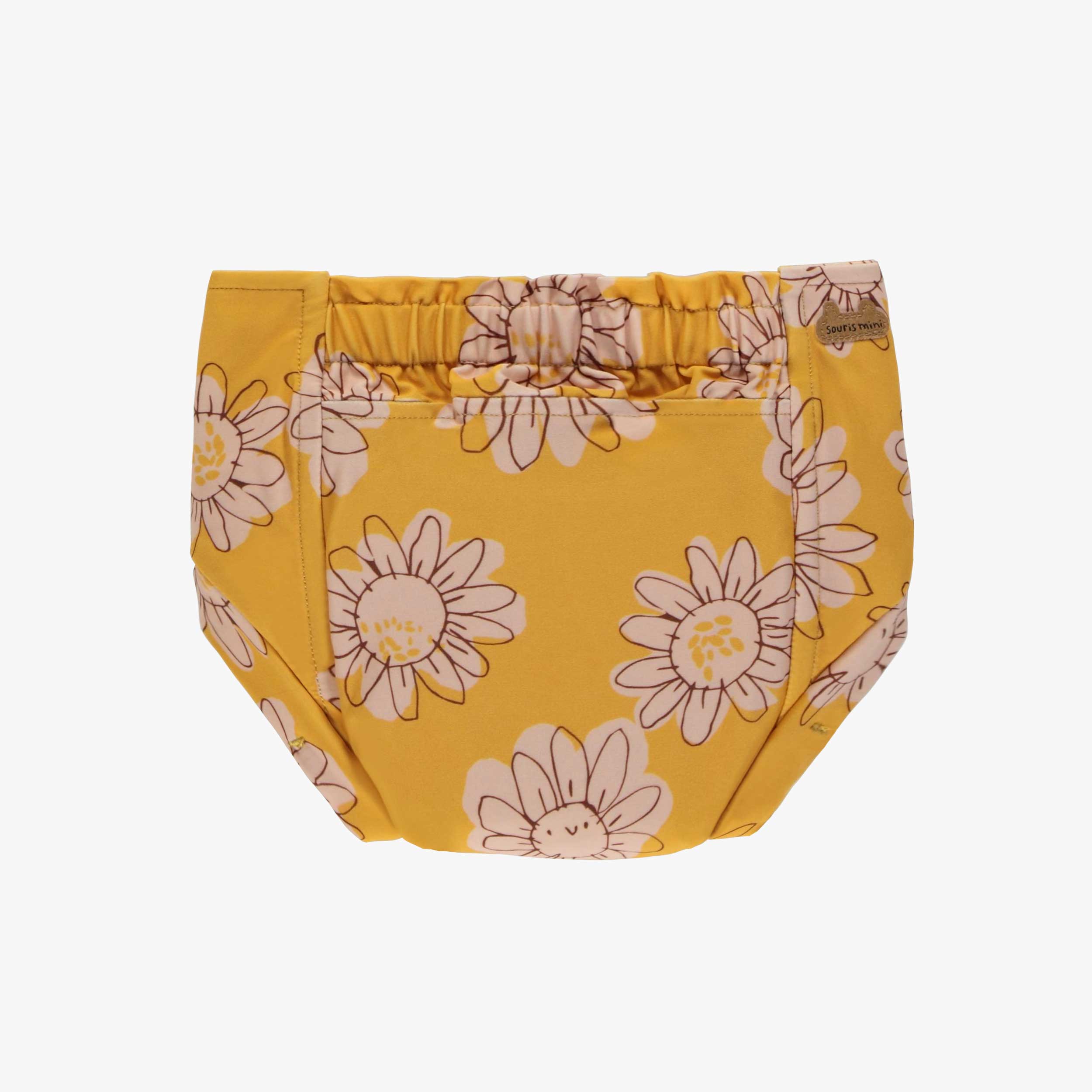 Derrière de la couche réutilisable ultramince jaune à motif de fleurs, bébé