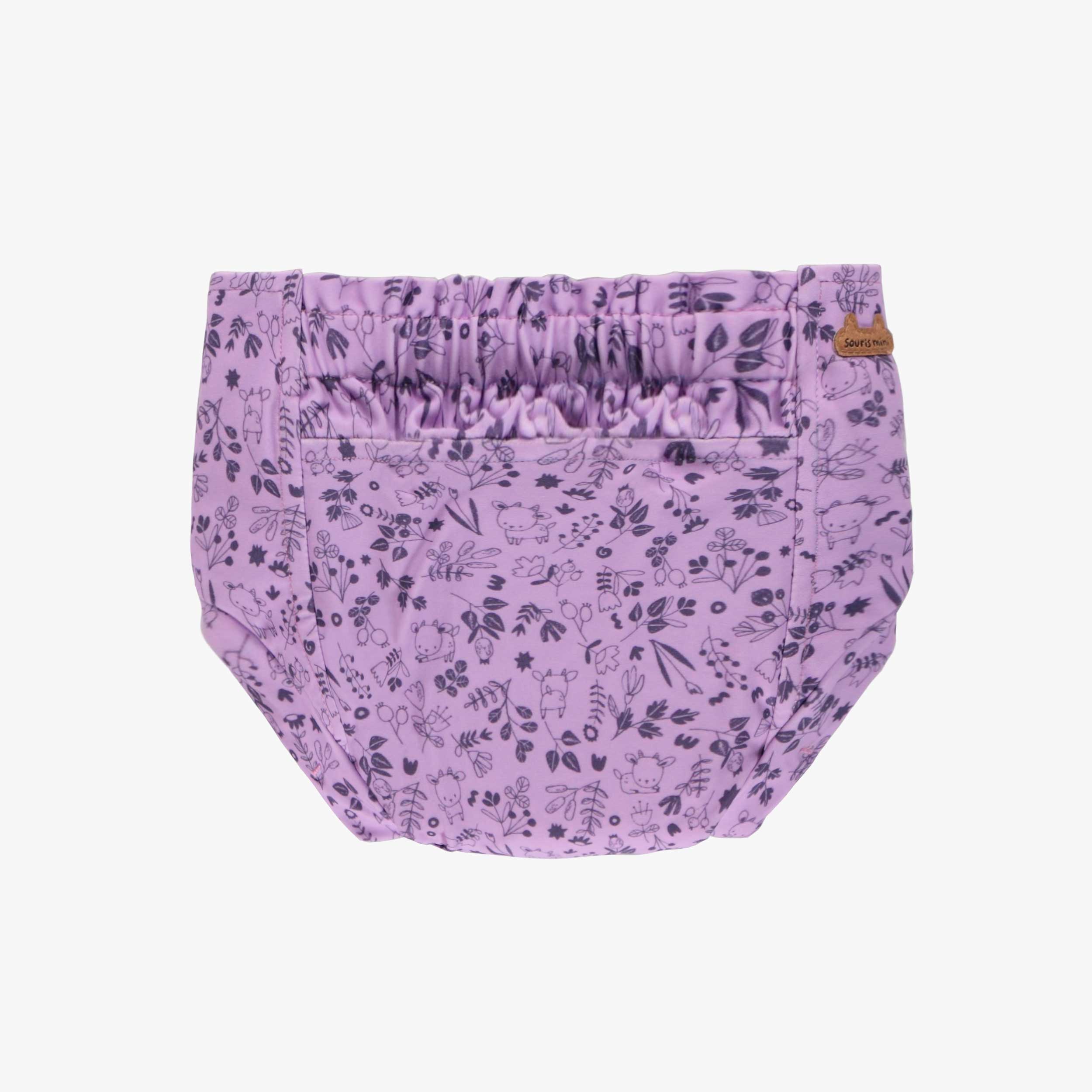 Dos de la couche réutilisable ultramince mauve à motif de fleurs, bébé