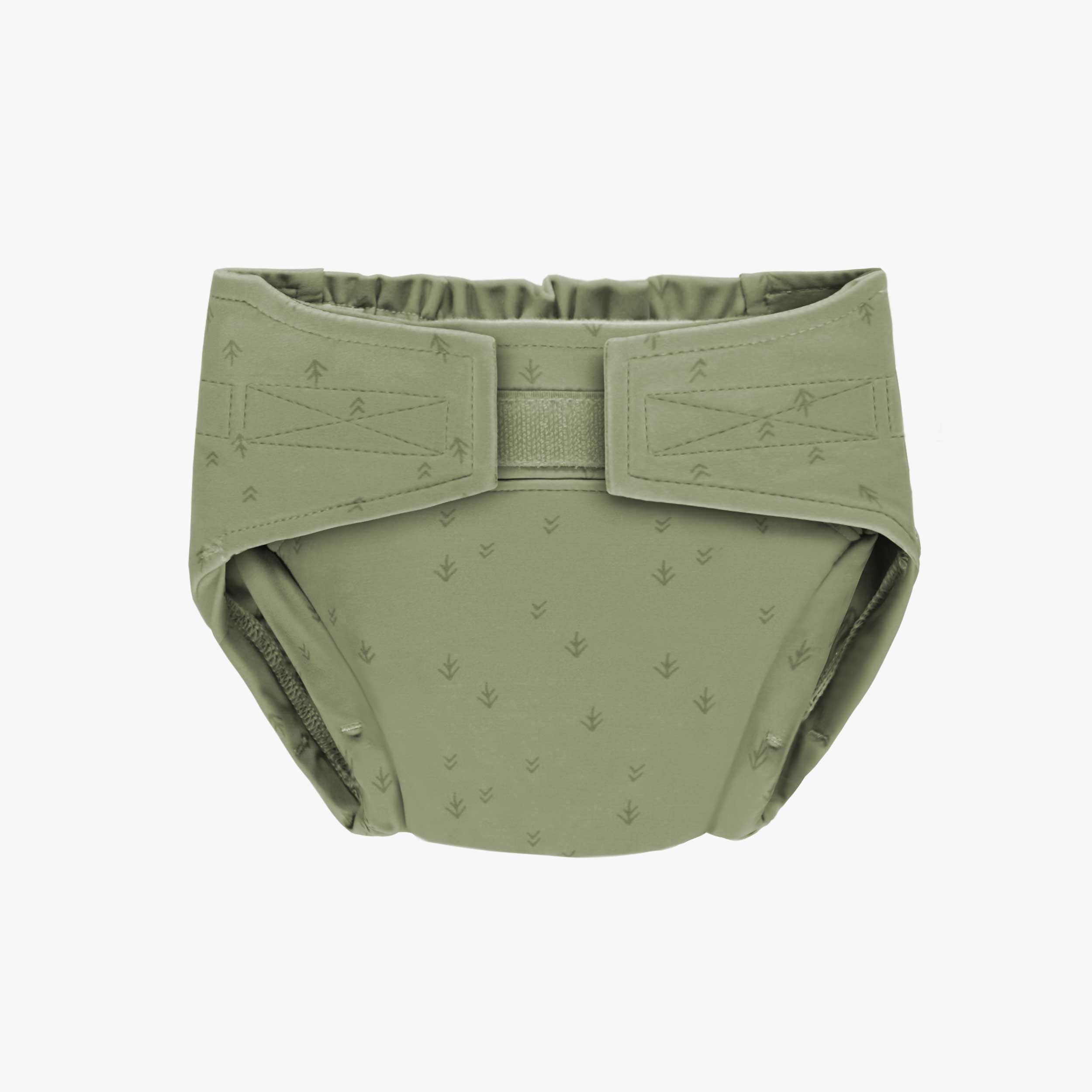 Sage green reusable diaper with arrow pattern, baby