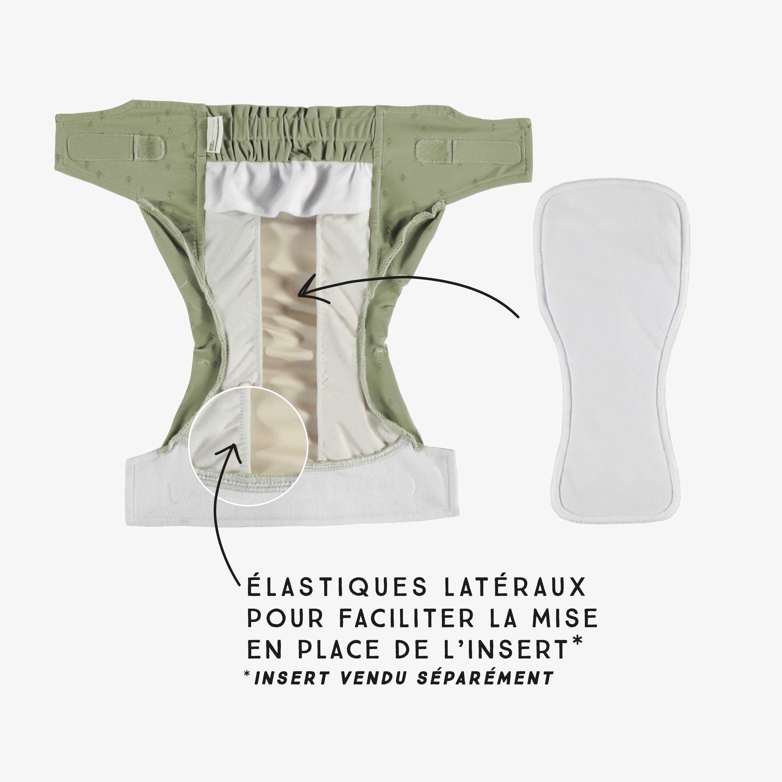 Sage green reusable diaper with arrow pattern, baby