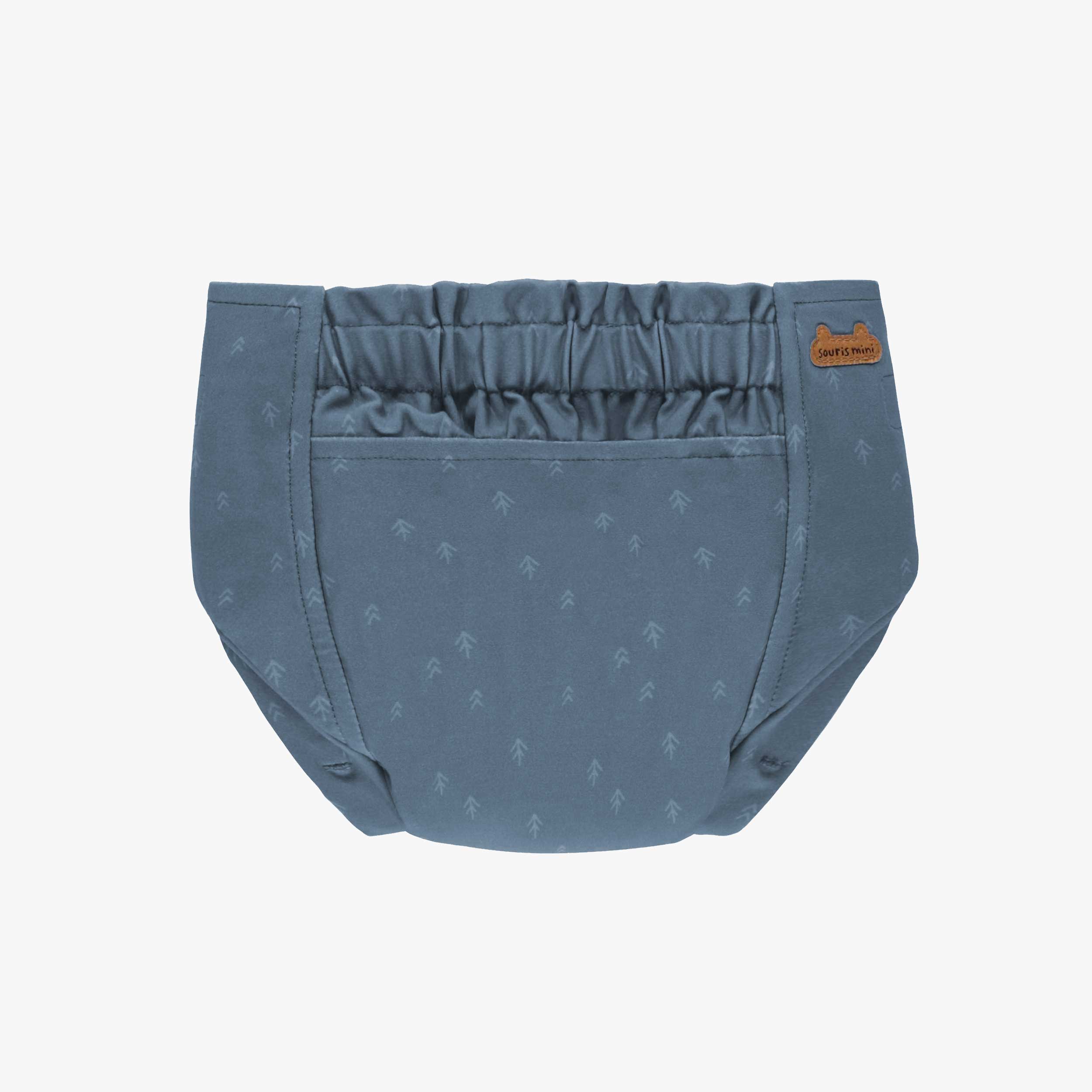 Dos de la couche réutilisable ultramince bleu à motif de flèches, bébé