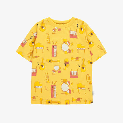 T-shirt ample jaune avec motif d'instruments de musique en jersey doux, enfant || Loose-fitting yellow t-shirt with musical instruments all over print in soft jersey, child