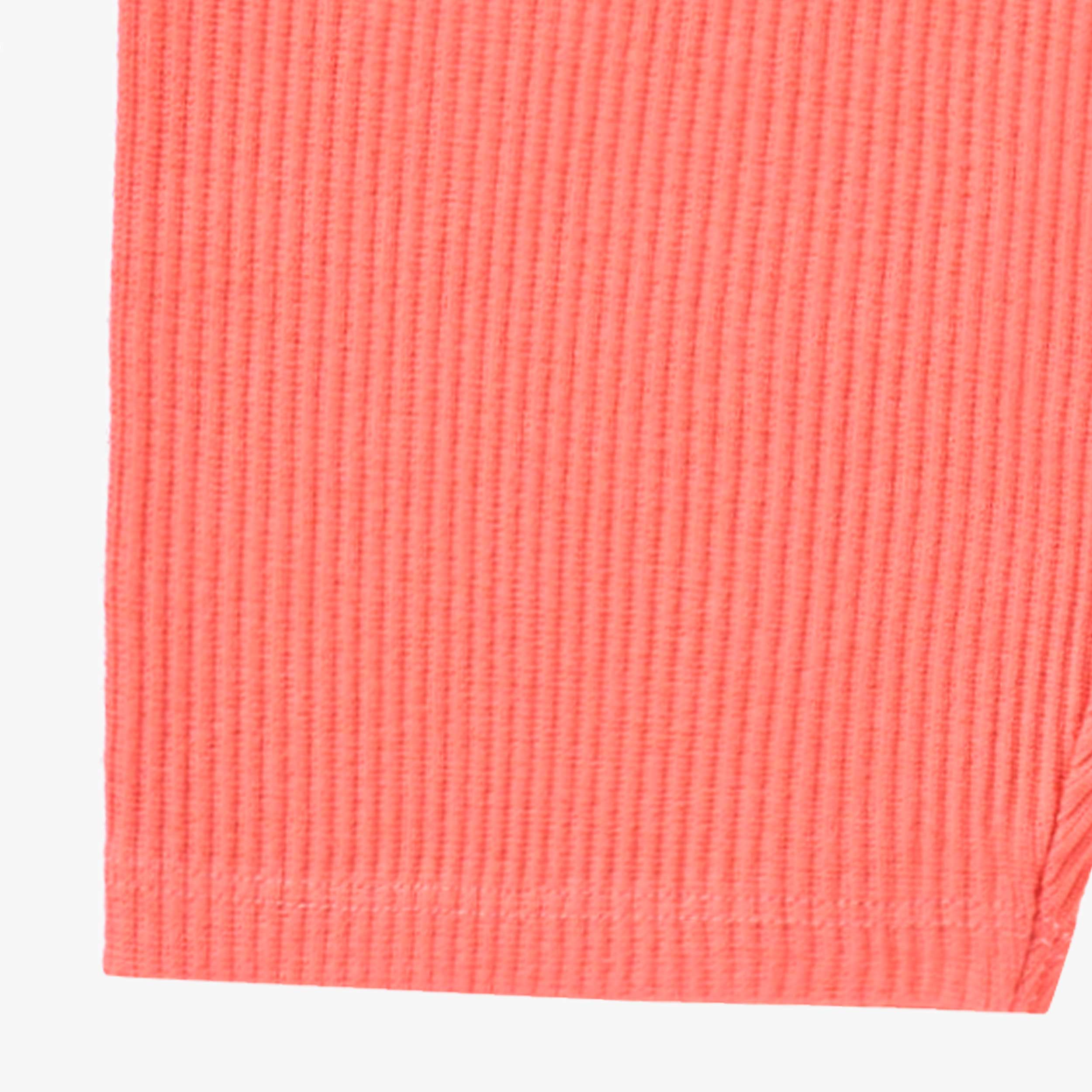 Détail du legging court rose en tricot côtelé, enfant