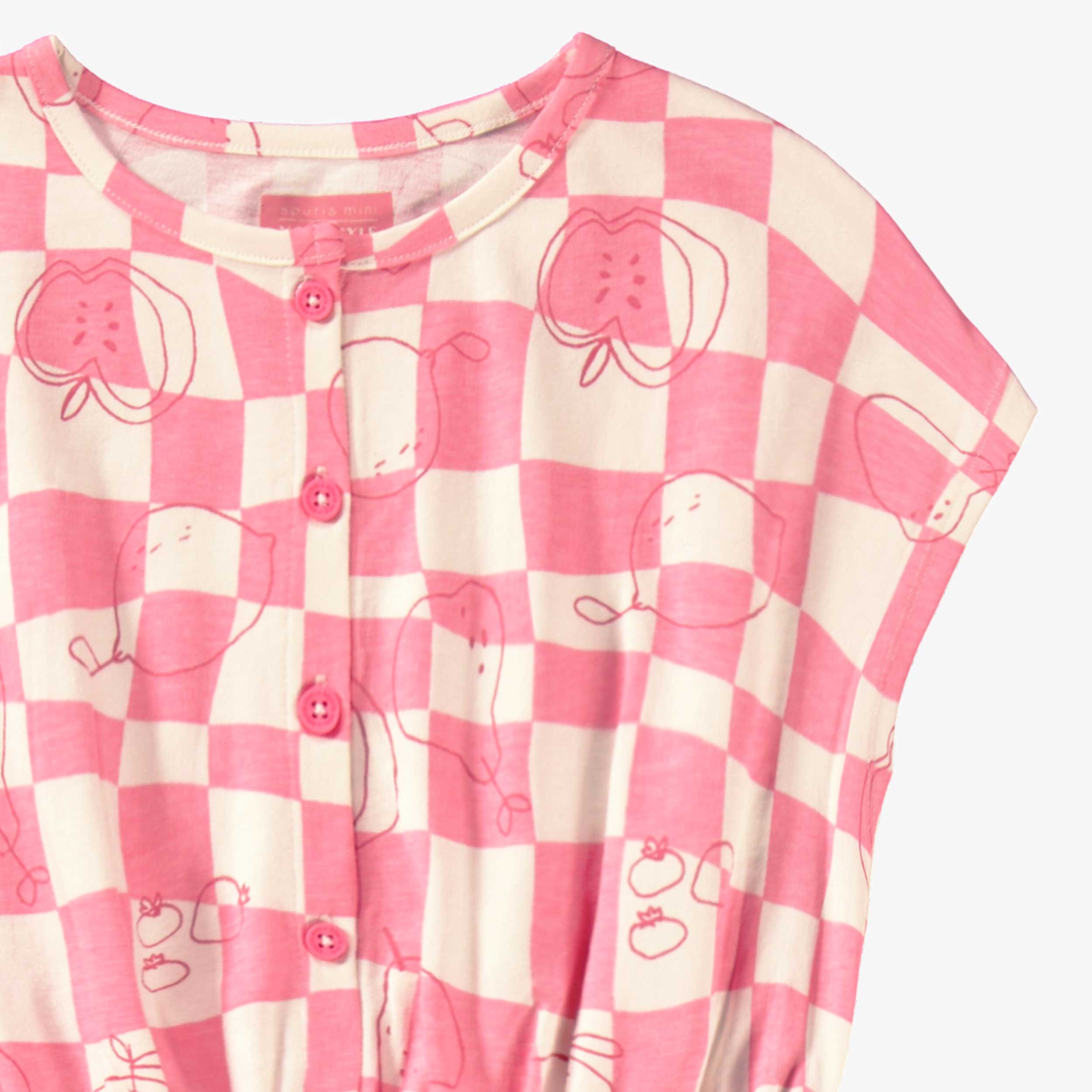Détail du combishort rose et crème à carreaux et motifs, enfant