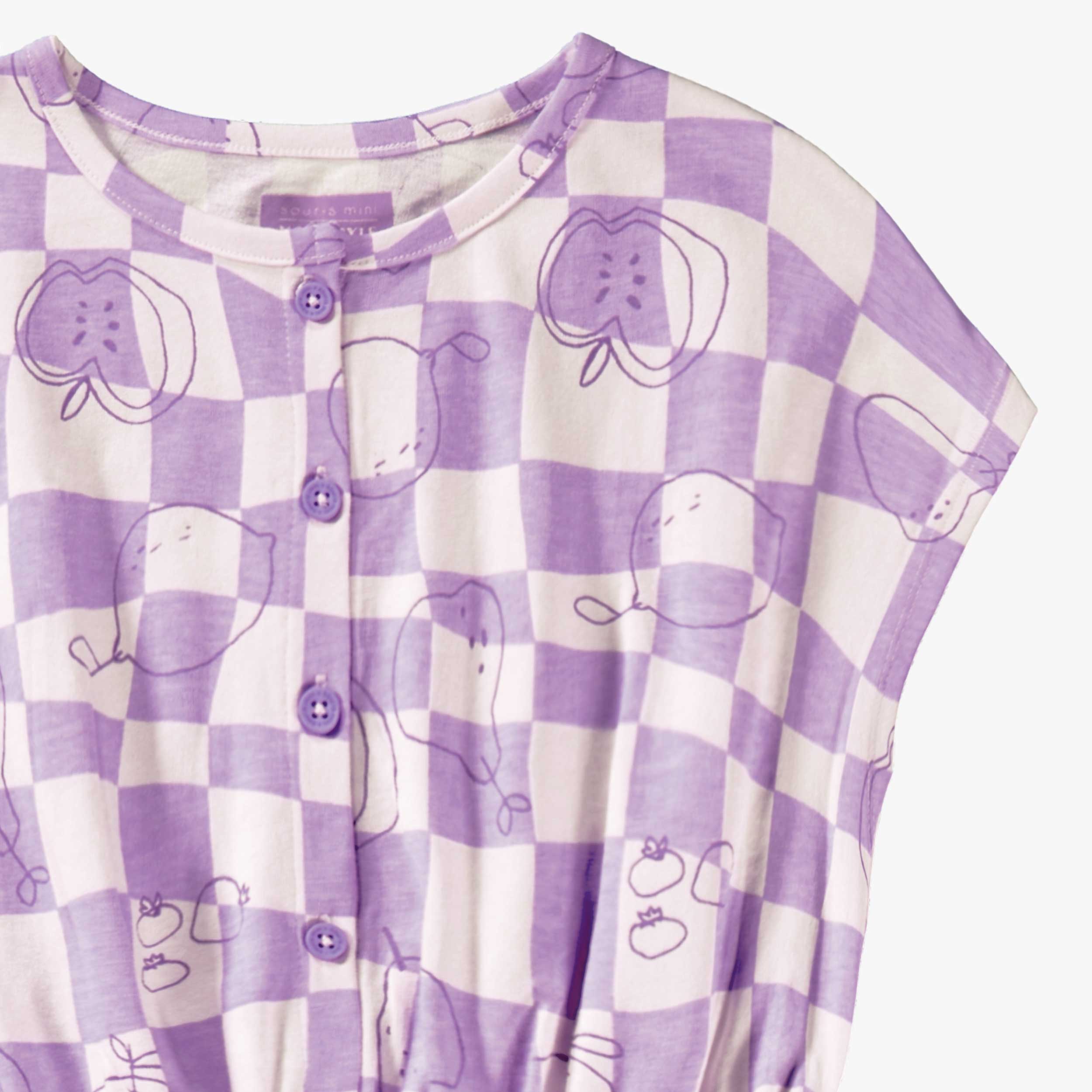 Détail du combishort mauve et crème à carreaux et motifs, enfant