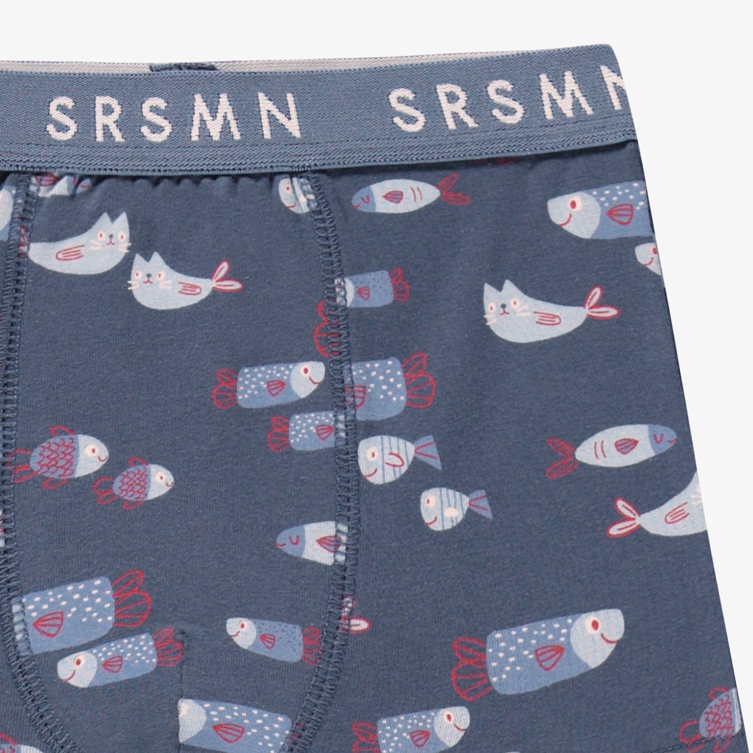 Détail du boxer bleu à motifs, enfant