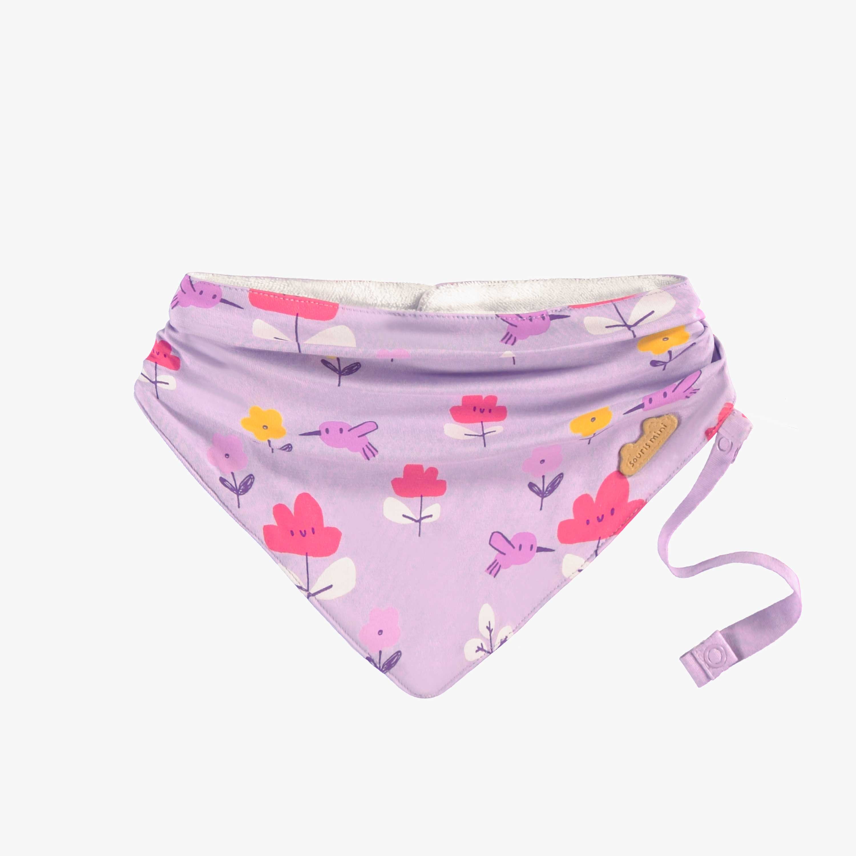 Bavoir mauve à motifs, naissance