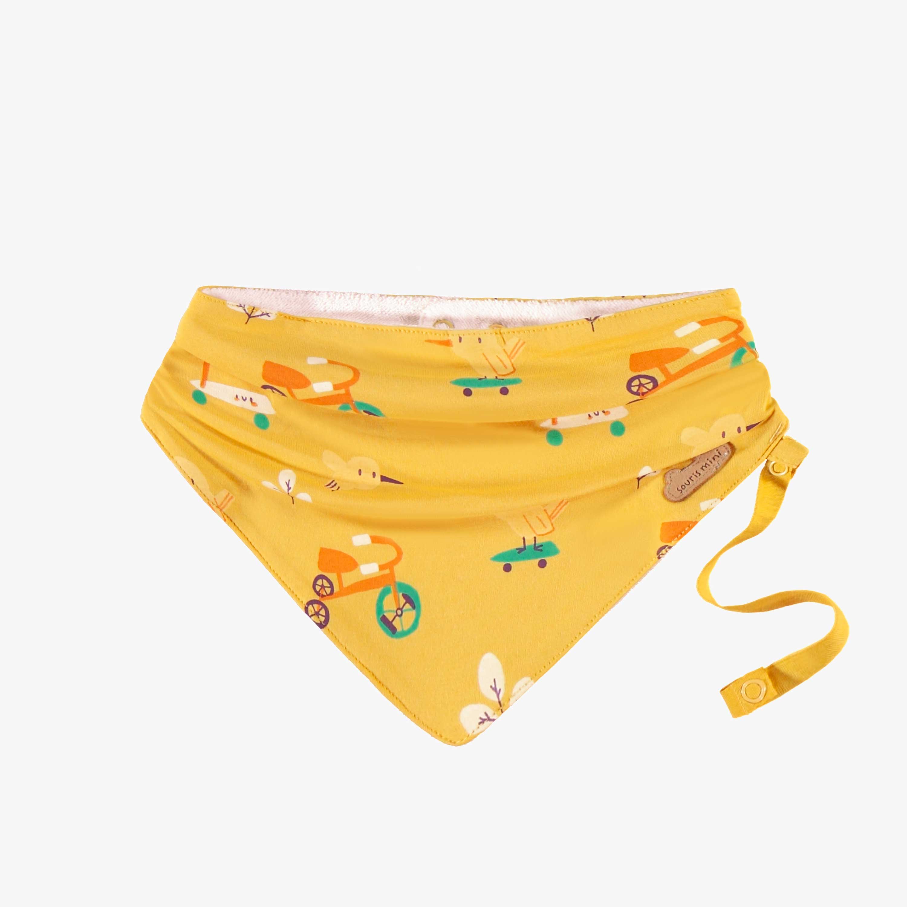 Bavoir jaune à motifs, naissance