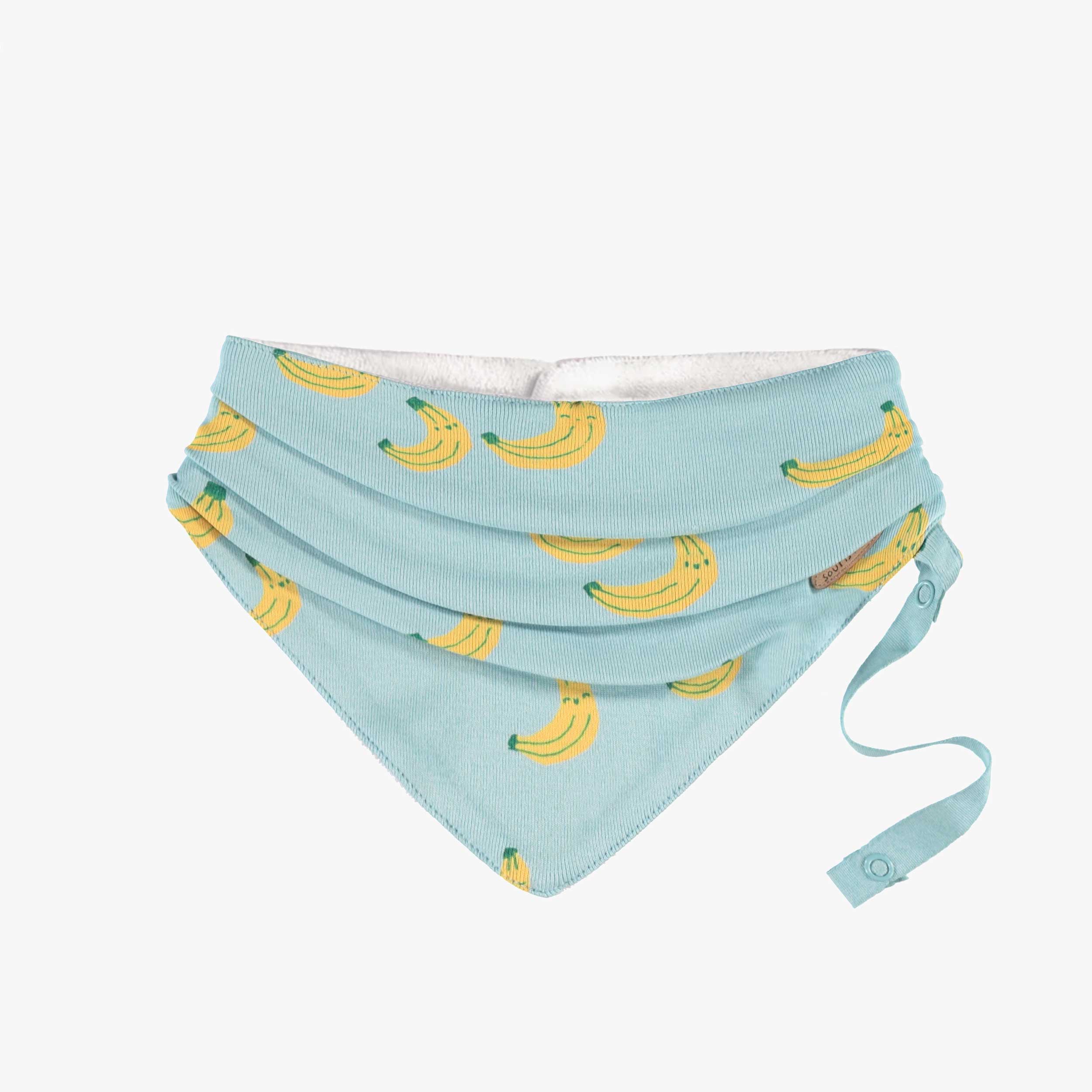 Bavoir bleu à motifs, naissance