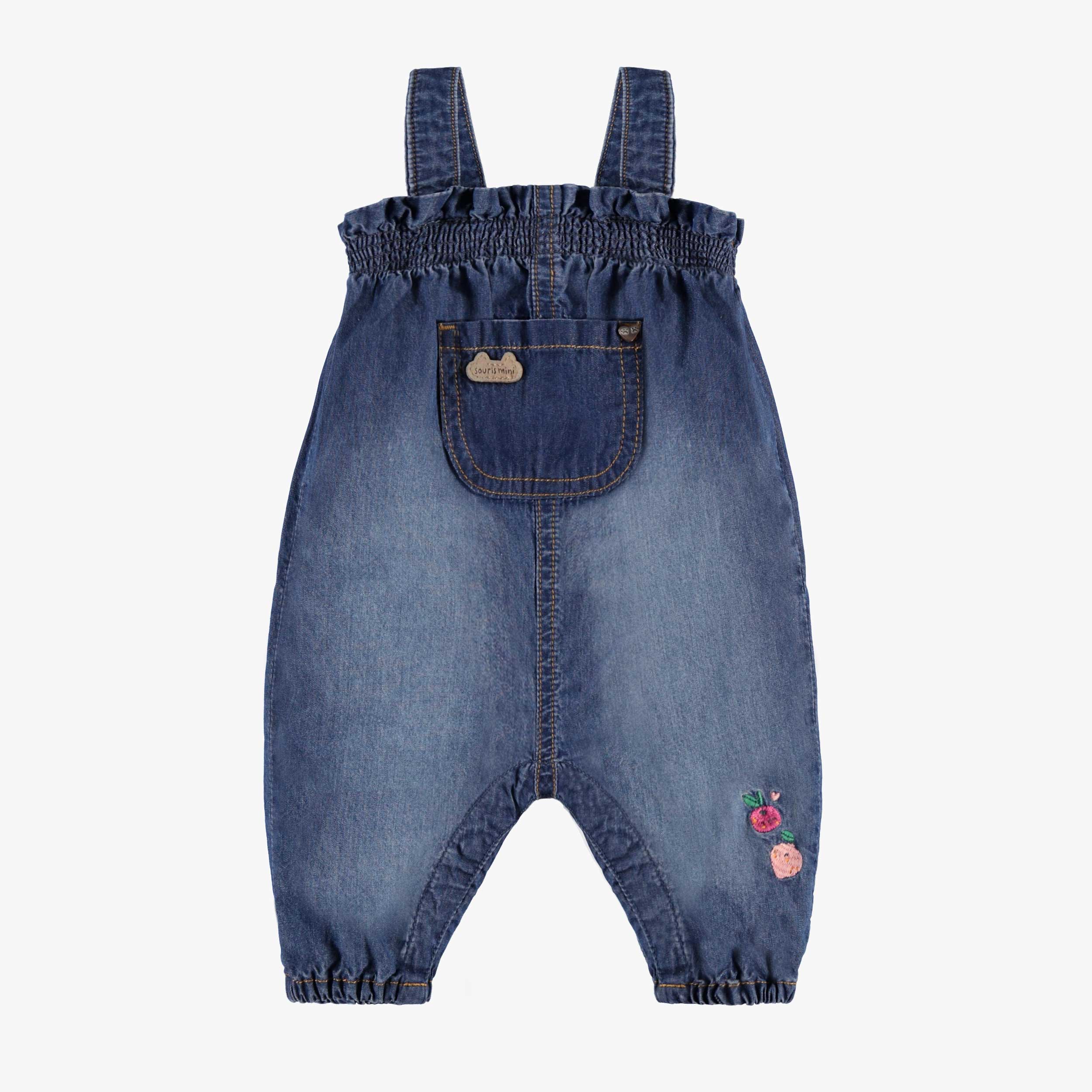 Salopette en denim bleu moyen au look usé, naissance