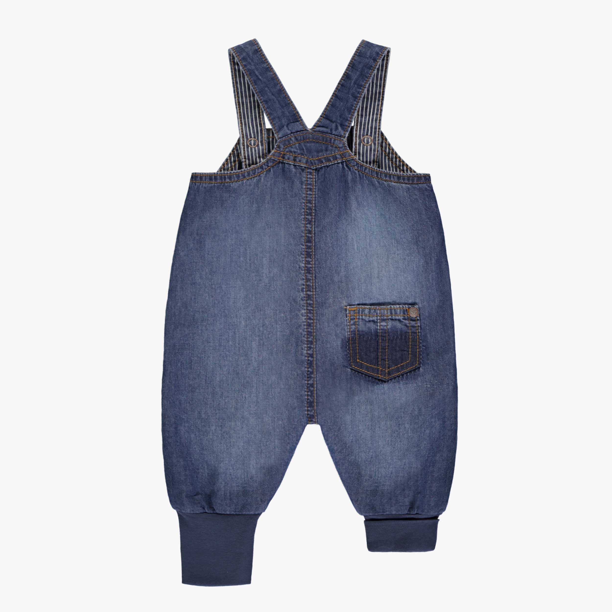 Dos de la salopette évolutive en denim bleu moyen à effet délavé, naissance