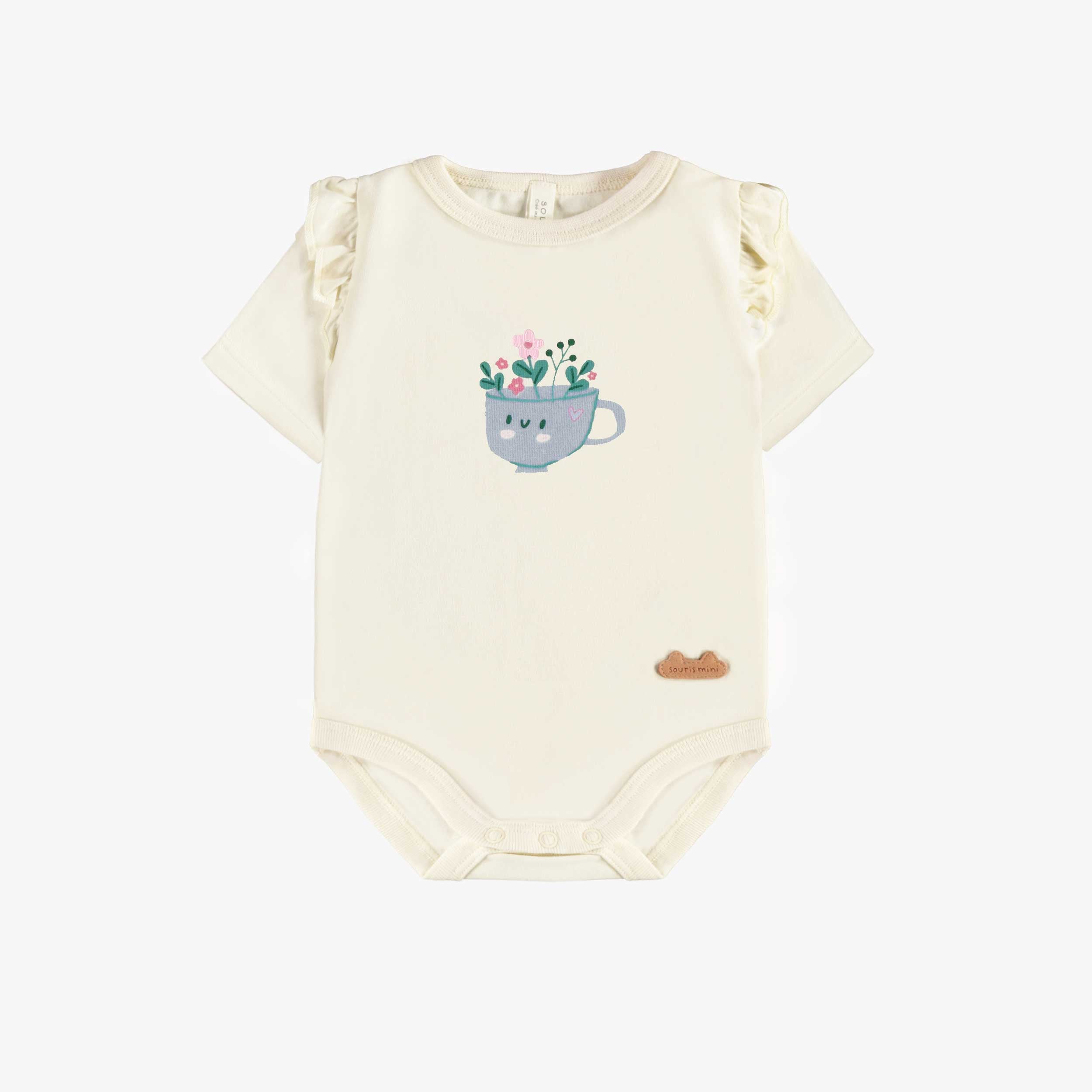 Cache-couche crème avec une tasse, naissance